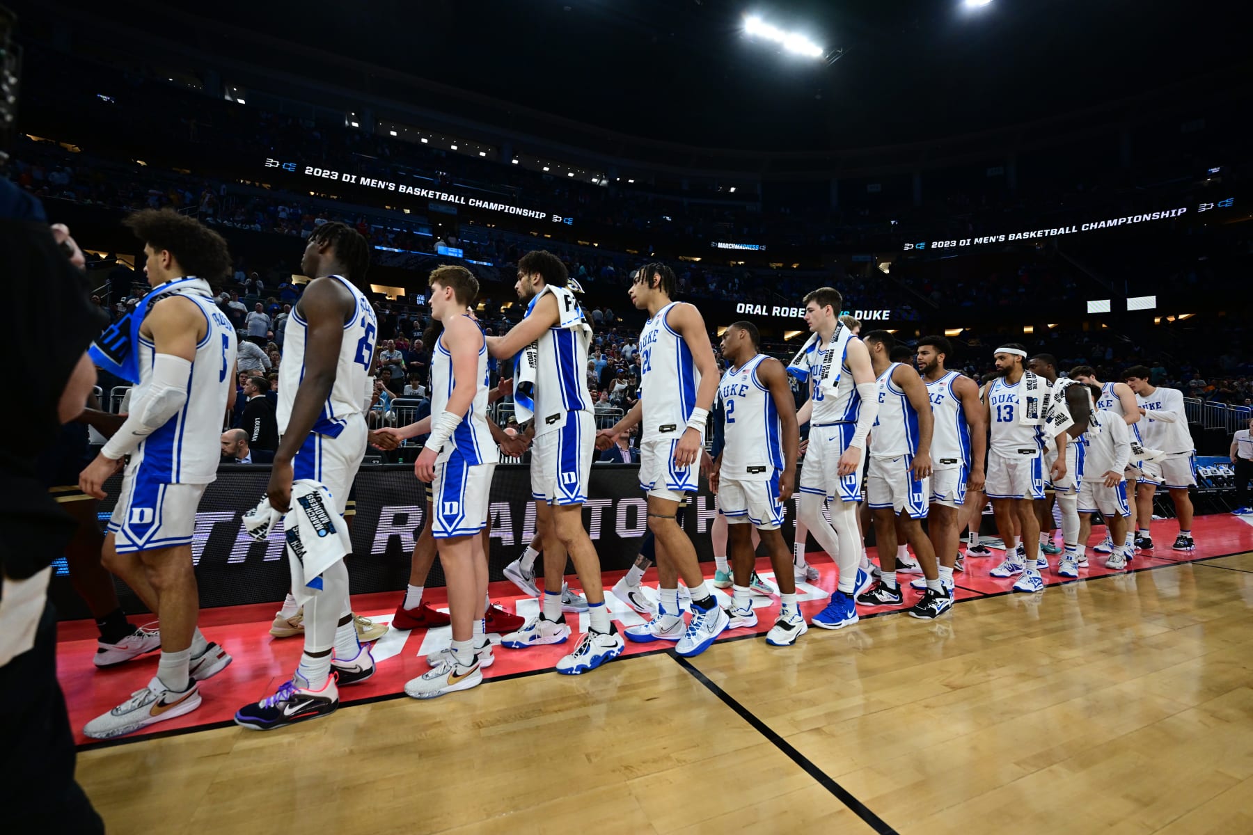 ORLANDO, FL - MARCH 16: The Duke Blue Devils shake hands with the Oral Roberts Golden Eagles during the first round of the 2023 NCAA Men's Basketball Tournament held at Amway Center on March 16, 2023 in Orlando, Florida. (Photo by Ben Solomon/NCAA Photos via Getty Images)