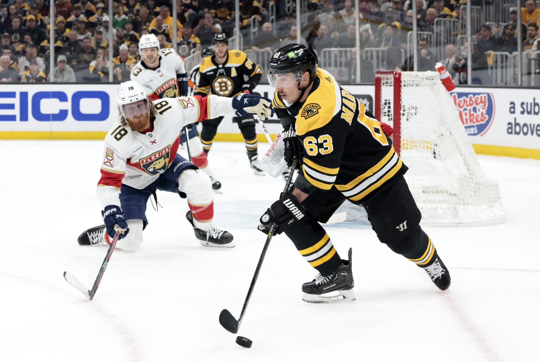 BOSTON, MA - APRIL 19: Boston Bruins left wing Brad Marchand (63) defended by Florida Panthers defenseman Marc Staal (18) during Game 2 of an Eastern Conference First Round playoff contest between the Boston Bruins and the Florida Panthers on April 19, 2023, at TD Garden in Boston, Massachusetts. (Photo by Fred Kfoury III/Icon Sportswire via Getty Images)