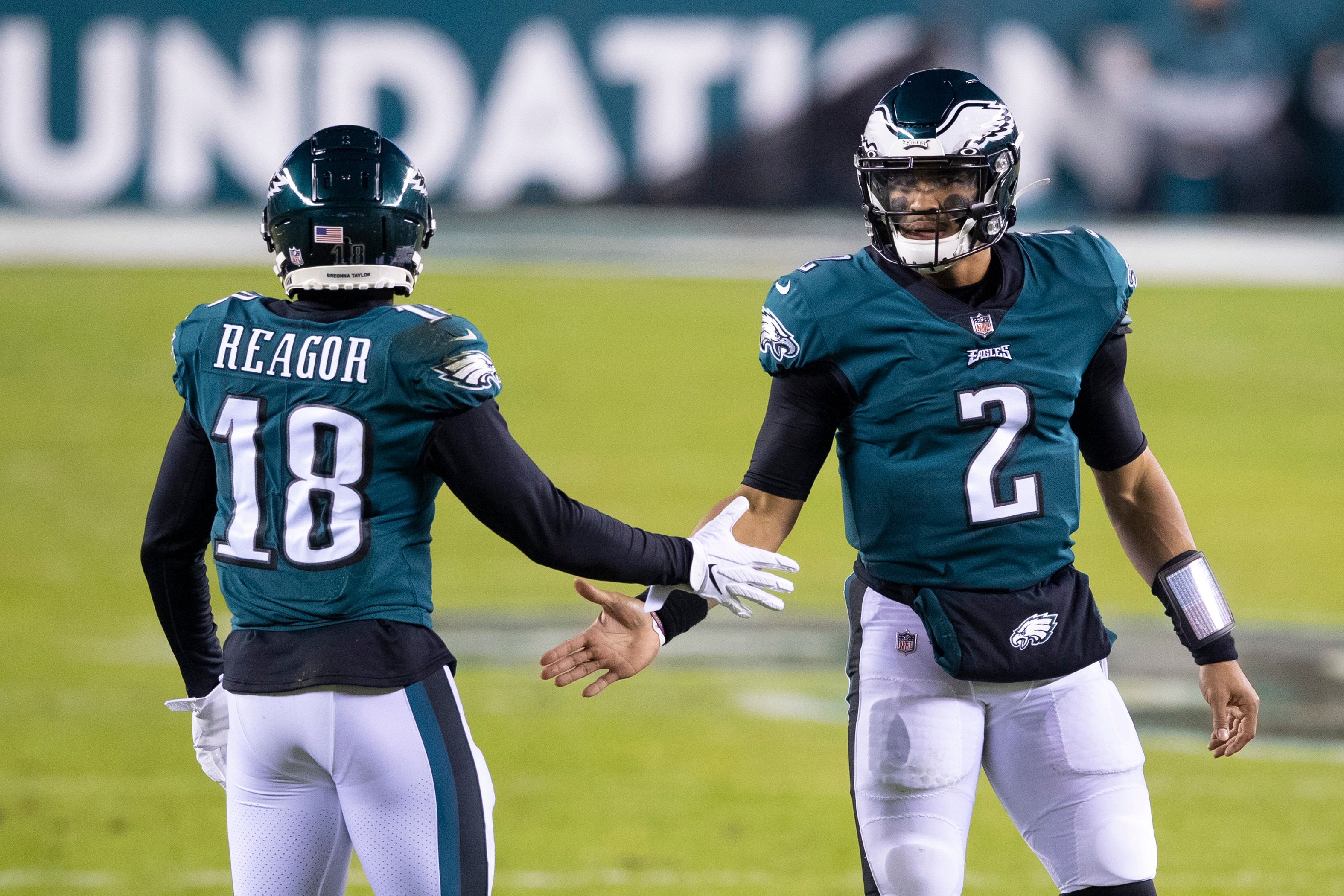PHILADELPHIA, PA - JANUARY 03: Jalen Reagor #18 and Jalen Hurts #2 of the Philadelphia Eagles react against the Washington Football Team at Lincoln Financial Field on January 3, 2021 in Philadelphia, Pennsylvania. (Photo by Mitchell Leff/Getty Images)