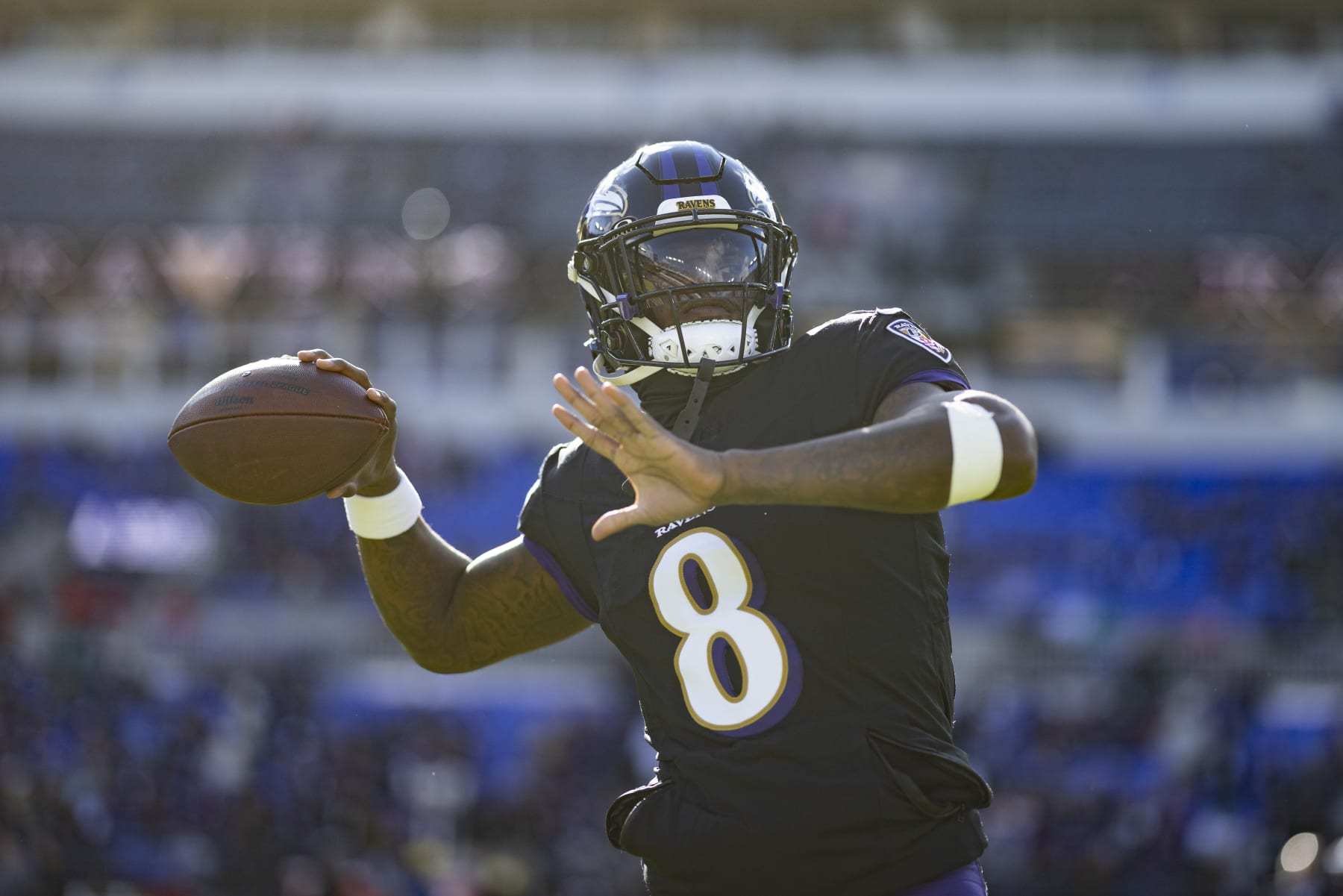 BALTIMORE, MARYLAND - DECEMBER 31: Lamar Jackson #8 of the Baltimore Ravens looks to pass as he warms up prior to an NFL football game between the Baltimore Ravens and the Miami Dolphins at M&T Bank Stadium on December 31, 2023 in Baltimore, Maryland. (Photo by Michael Owens/Getty Images)