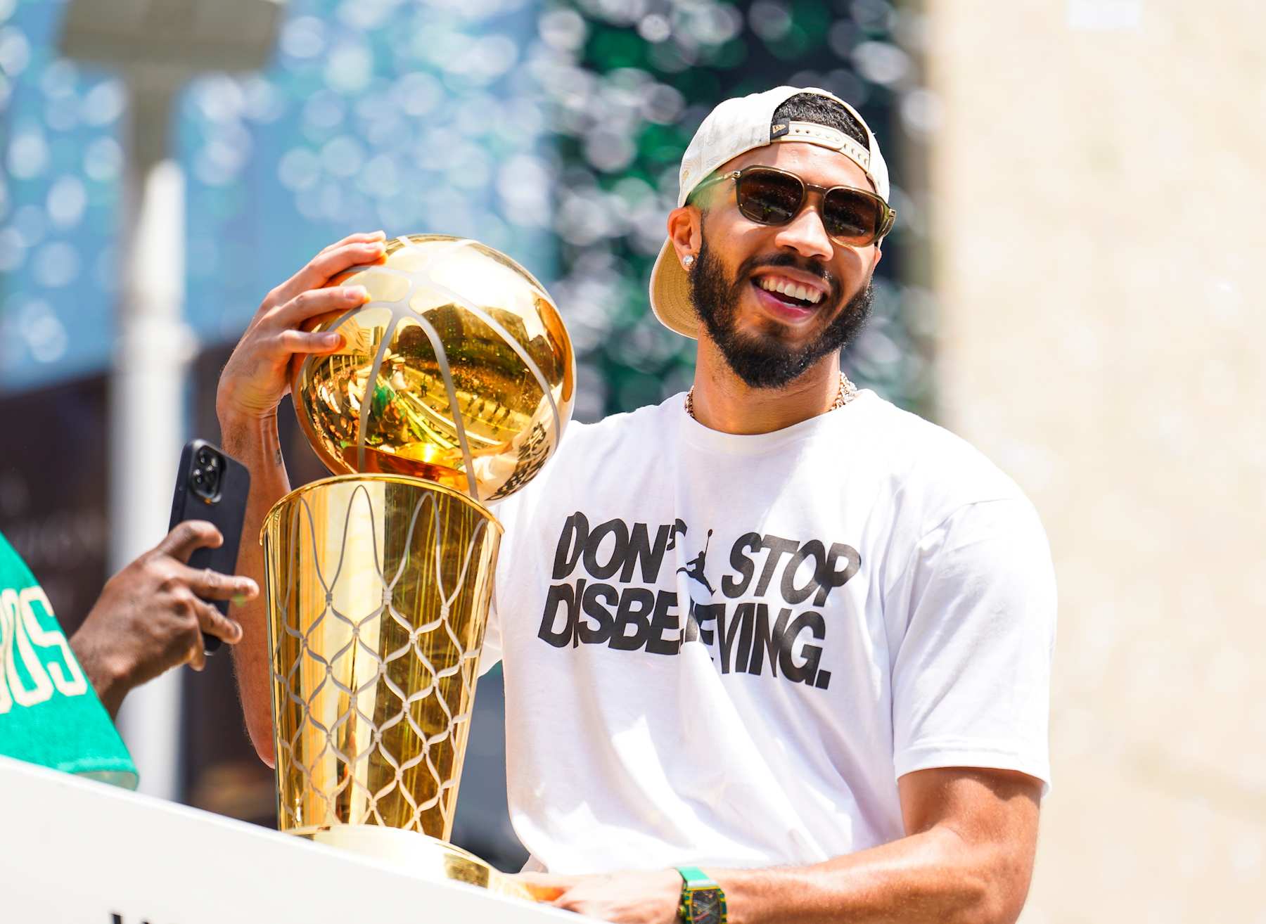 Boston, MA - June 21: Boston Celtics SF Jayson Tatum celebrates during a duck boat parade to celebrate the 18th Boston Celtics NBA championship. (Photo by Kayla Bartkowski/The Boston Globe via Getty Images)
