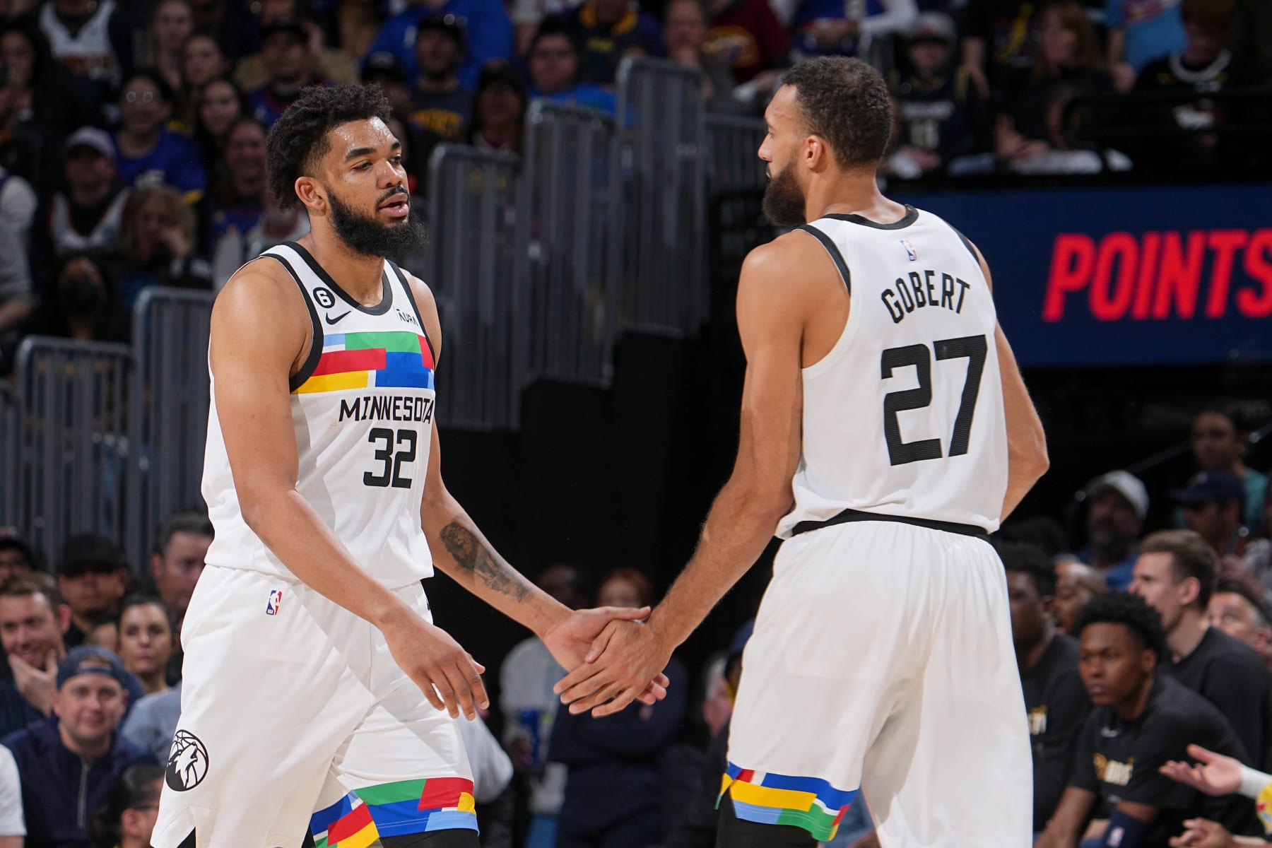 DENVER, CO - APRIL 19:  Karl-Anthony Towns #32 of the Minnesota Timberwolves high fives Rudy Gobert #27 during the game against the Denver Nuggets during Round One Game Two of the 2023 NBA Playoffs on April 19, 2023 at the Ball Arena in Denver, Colorado. NOTE TO USER: User expressly acknowledges and agrees that, by downloading and/or using this Photograph, user is consenting to the terms and conditions of the Getty Images License Agreement. Mandatory Copyright Notice: Copyright 2023 NBAE (Photo by Bart Young/NBAE via Getty Images)
