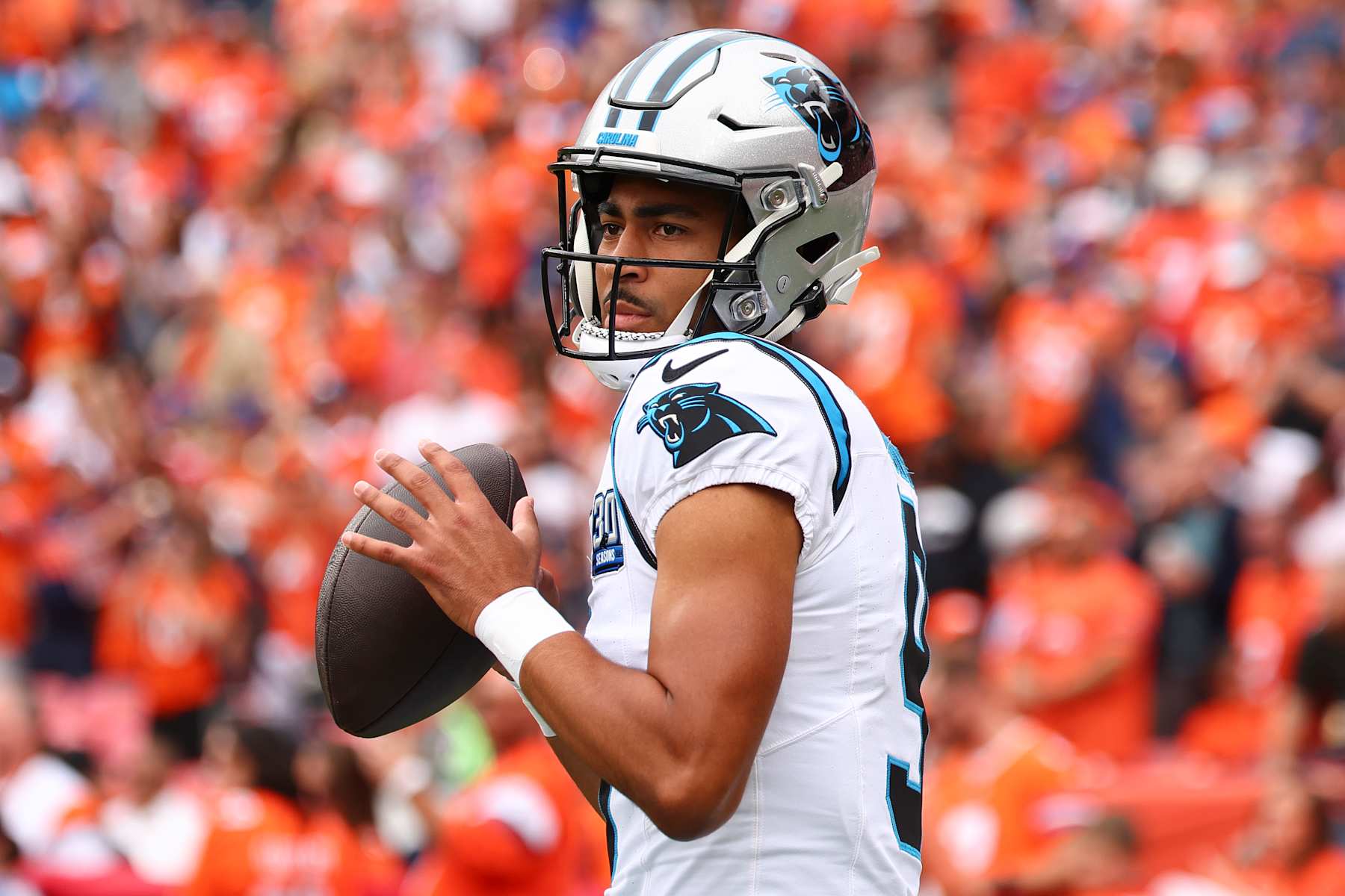 DENVER, COLORADO - OCTOBER 27: Bryce Young #9 of the Carolina Panthers warms up against the Denver Broncos at Empower Field At Mile High on October 27, 2024 in Denver, Colorado. The Broncos defeated the Panthers 28-14. (Photo by C. Morgan Engel/Getty Images)