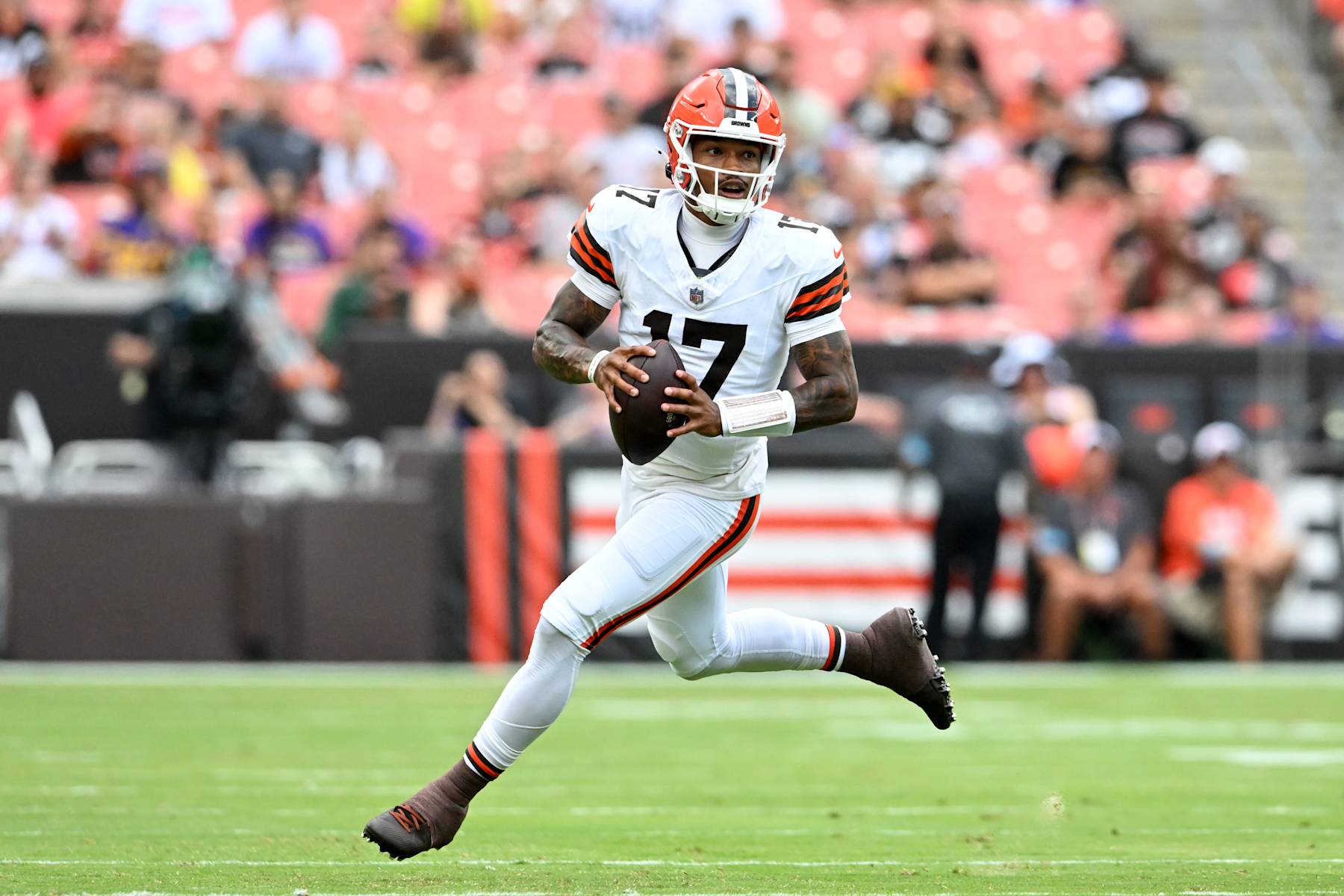 CLEVELAND, OHIO - AUGUST 17: Dorian Thompson-Robinson #17 of the Cleveland Browns looks to pass as he rolls out of the pocket during the first half of a preseason game against the Minnesota Vikings at Cleveland Browns Stadium on August 17, 2024 in Cleveland, Ohio. (Photo by Nick Cammett/Getty Images)