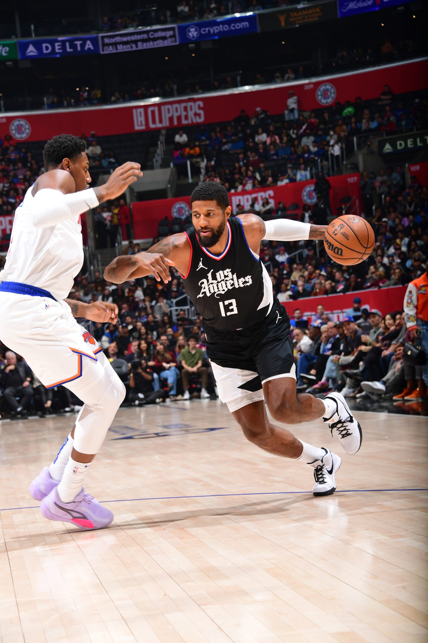 LOS ANGELES, CA - DECEMBER 16: Paul George #13 of the LA Clippers dribbles the ball during the game against the New York Knicks on December 16, 2023 at Crypto.Com Arena in Los Angeles, California. NOTE TO USER: User expressly acknowledges and agrees that, by downloading and/or using this Photograph, user is consenting to the terms and conditions of the Getty Images License Agreement. Mandatory Copyright Notice: Copyright 2023 NBAE (Photo by Adam Pantozzi/NBAE via Getty Images)
