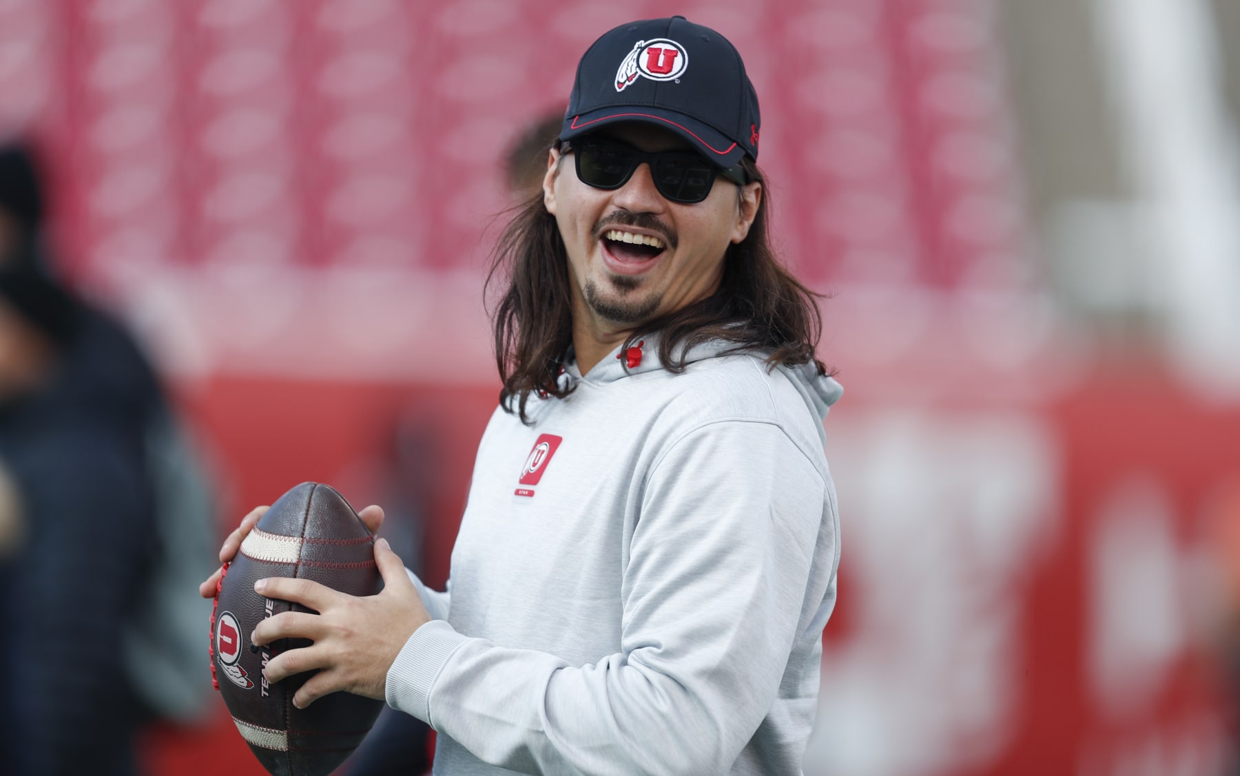 SALT LAKE CITY, UT - NOVEMBER 25: Cameron Rising #7 of the Utah Utes laughs during warmups before their game against the Colorado Buffaloes at Rice Eccles Stadium on November 25, 2023 in Salt Lake City, Utah.  (Photo by Chris Gardner/Getty Images)