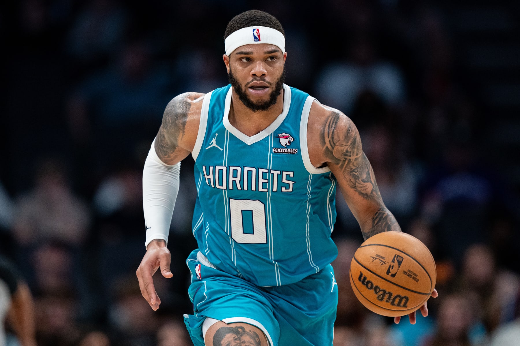 CHARLOTTE, NORTH CAROLINA - JANUARY 27: Miles Bridges #0 of the Charlotte Hornets brings the ball up court against the Utah Jazz during their game at Spectrum Center on January 27, 2024 in Charlotte, North Carolina. NOTE TO USER: User expressly acknowledges and agrees that, by downloading and or using this photograph, User is consenting to the terms and conditions of the Getty Images License Agreement. (Photo by Jacob Kupferman/Getty Images)