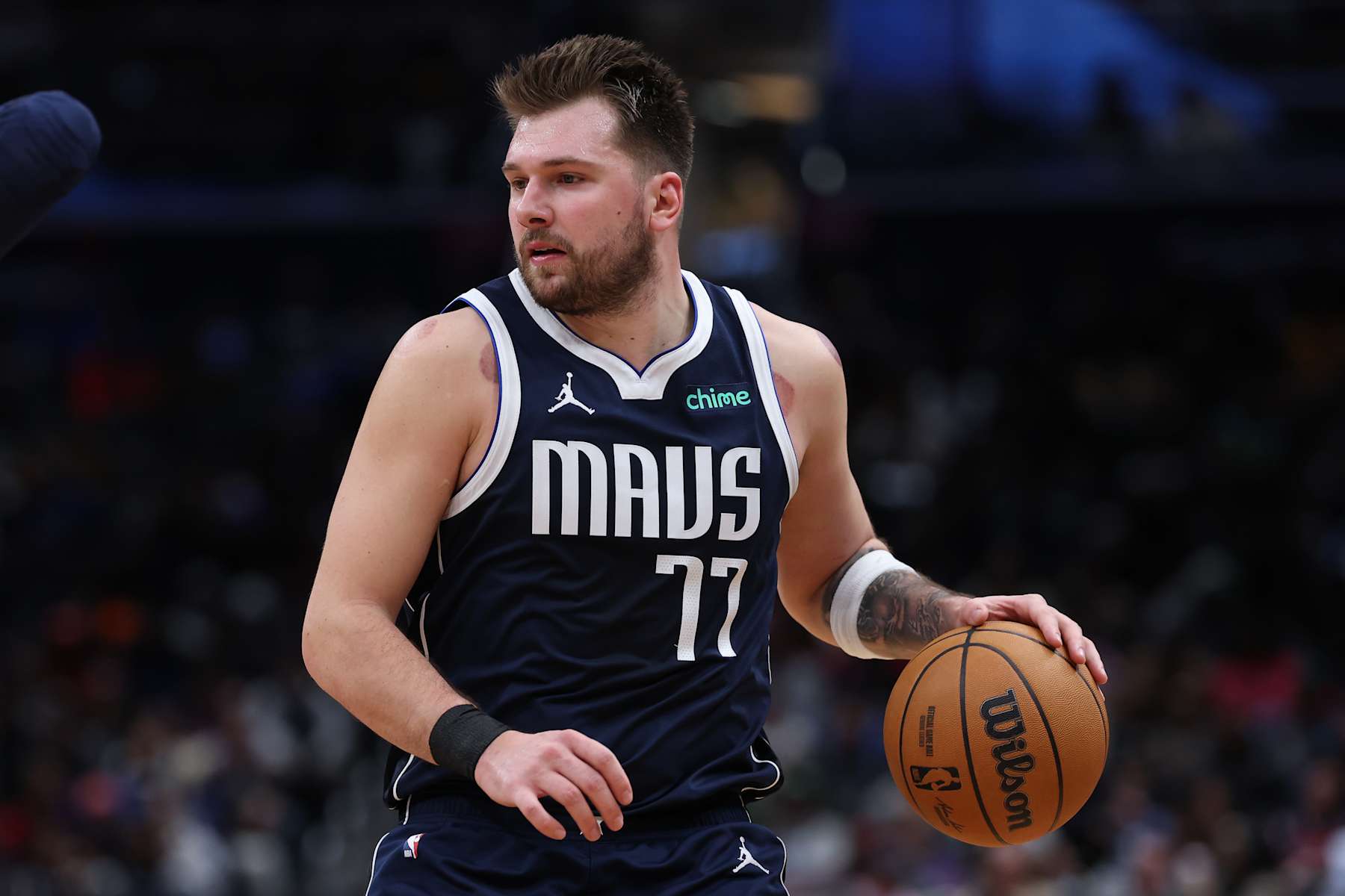 WASHINGTON, DC - DECEMBER 05: Luka Doncic #77 of the Dallas Mavericks dribbles the ball against the Washington Wizards at Capital One Arena on December 05, 2024 in Washington, DC. NOTE TO USER: User expressly acknowledges and agrees that, by downloading and or using this photograph, User is consenting to the terms and conditions of the Getty Images License Agreement. (Photo by Patrick Smith/Getty Images)