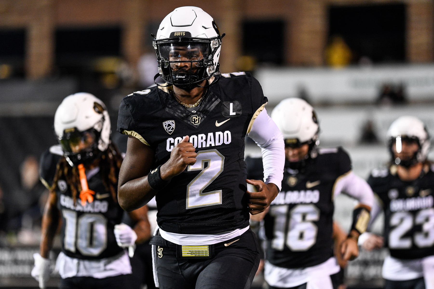 BOULDER, CO - NOVEMBER 4: Shedeur Sanders #2 of the Colorado Buffaloes runs onto the field before a game against the Oregon State Beavers at Folsom Field on November 4, 2023 in Boulder, Colorado. (Photo by Dustin Bradford/Getty Images) BOULDER, CO - NOVEMBER 4: Shedeur Sanders #2 of the Colorado Buffaloes runs onto the field before a game against the Oregon State Beavers at Folsom Field on November 4, 2023 in Boulder, Colorado. (Photo by Dustin Bradford/Getty Images)