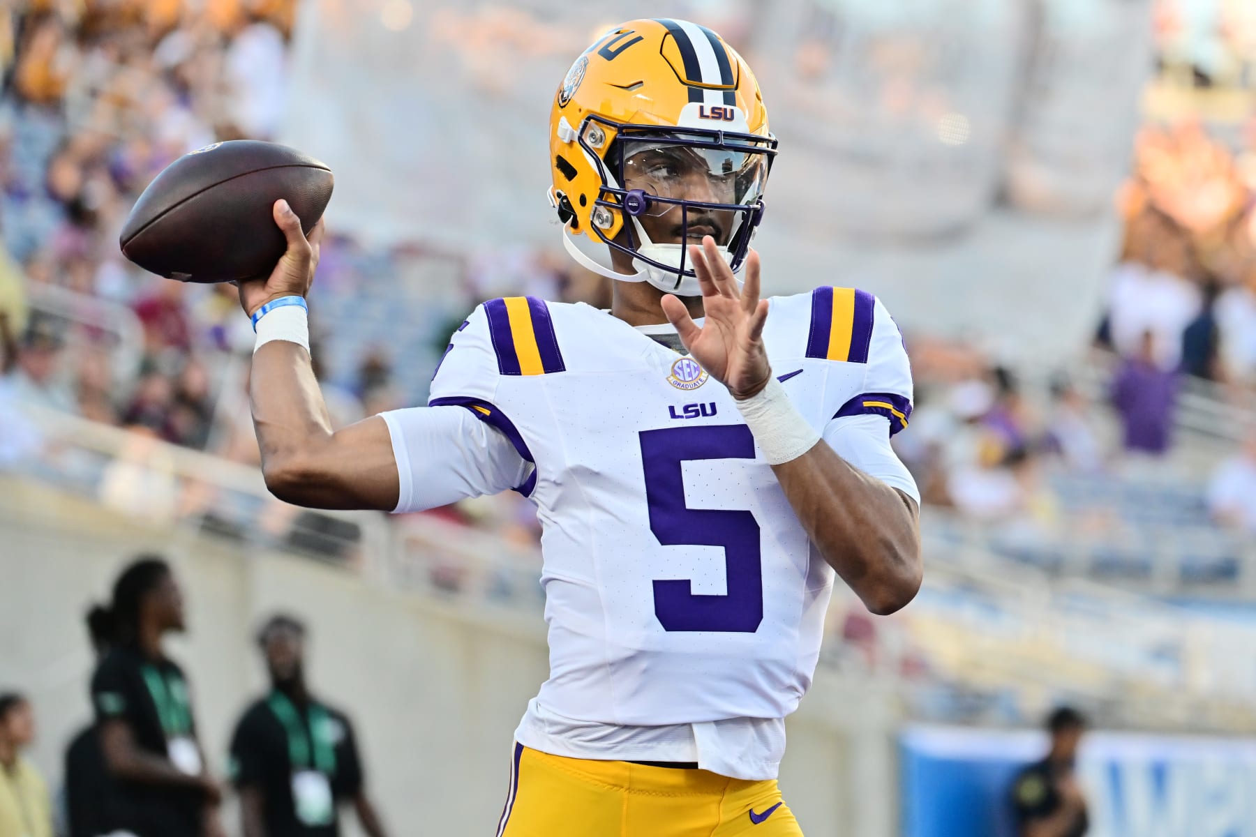 ORLANDO, FLORIDA - SEPTEMBER 03: Jayden Daniels #5 of the LSU Tigers warms up prior to a game against the Florida State Seminoles at Camping World Stadium on September 03, 2023 in Orlando, Florida. (Photo by Julio Aguilar/Getty Images)