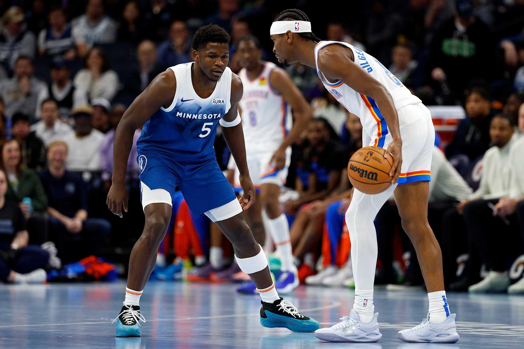 MINNEAPOLIS, MINNESOTA - NOVEMBER 28: Shai Gilgeous-Alexander #2 of the Oklahoma City Thunder dribbles the ball while Anthony Edwards #5 of the Minnesota Timberwolves defends in the first quarter during an NBA In-Season Tournament game at Target Center on November 28, 2023 in Minneapolis, Minnesota. The Timberwolves defeated the Thunder 106-103. NOTE TO USER: User expressly acknowledges and agrees that, by downloading and or using this photograph, User is consenting to the terms and conditions of the Getty Images License Agreement. (Photo by David Berding/Getty Images)