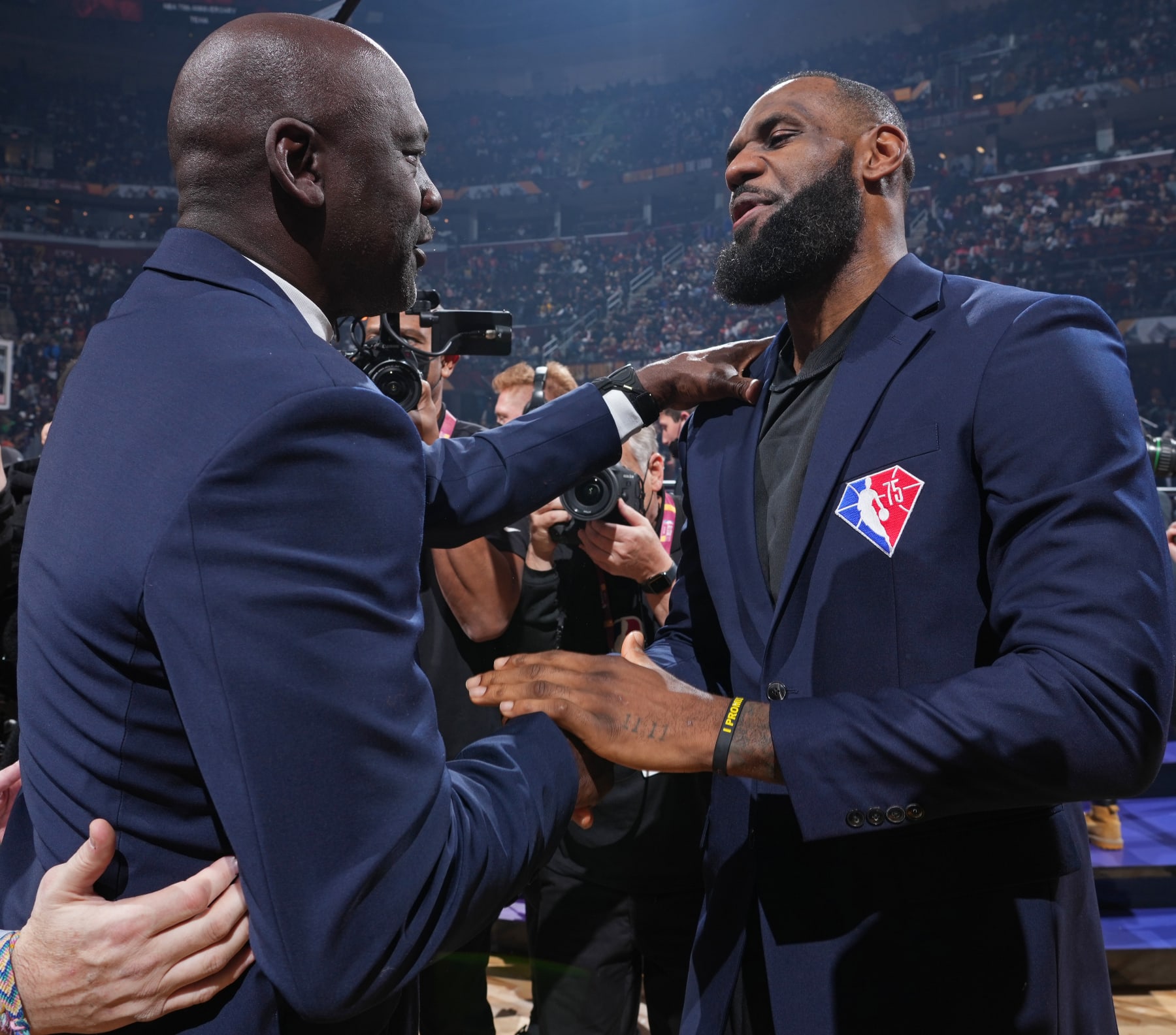 CLEVELAND, OH - FEBRUARY 20: NBA Legends, Michael Jordan and LeBron James shake hands during the 2022 NBA All-Star Game as part of 2022 NBA All Star Weekend on February 20, 2022 at Rocket Mortgage FieldHouse in Cleveland, Ohio. NOTE TO USER: User expressly acknowledges and agrees that, by downloading and/or using this Photograph, user is consenting to the terms and conditions of the Getty Images License Agreement. Mandatory Copyright Notice: Copyright 2022 NBAE (Photo by Jesse D. Garrabrant/NBAE via Getty Images)