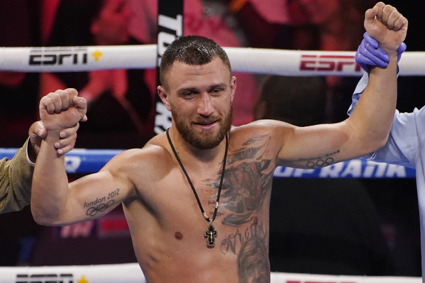 FILE -Vasiliy Lomachenko, of Ukraine, celebrates after defeating Masayoshi Nakatani, of Japan, by technical knockout during a lightweight bout Saturday, June 26, 2021, in Las Vegas. When Ukraine was invaded, the only fight Vasiliy Lomachenko would consider was the one for his home. Boxing plans were put on hold, even though they appeared set to include a title match. Lomachenko calls being undisputed champion his dream, but his country's war with Russia is real life. (AP Photo/John Locher, File)