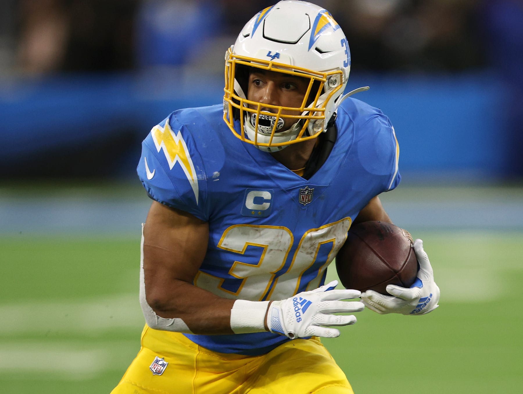 INGLEWOOD, CALIFORNIA - DECEMBER 11: Austin Ekeler #30 of the Los Angeles Chargers runs after his catch during a 23-17 win over the Miami Dolphins at SoFi Stadium on December 11, 2022 in Inglewood, California. (Photo by Harry How/Getty Images)