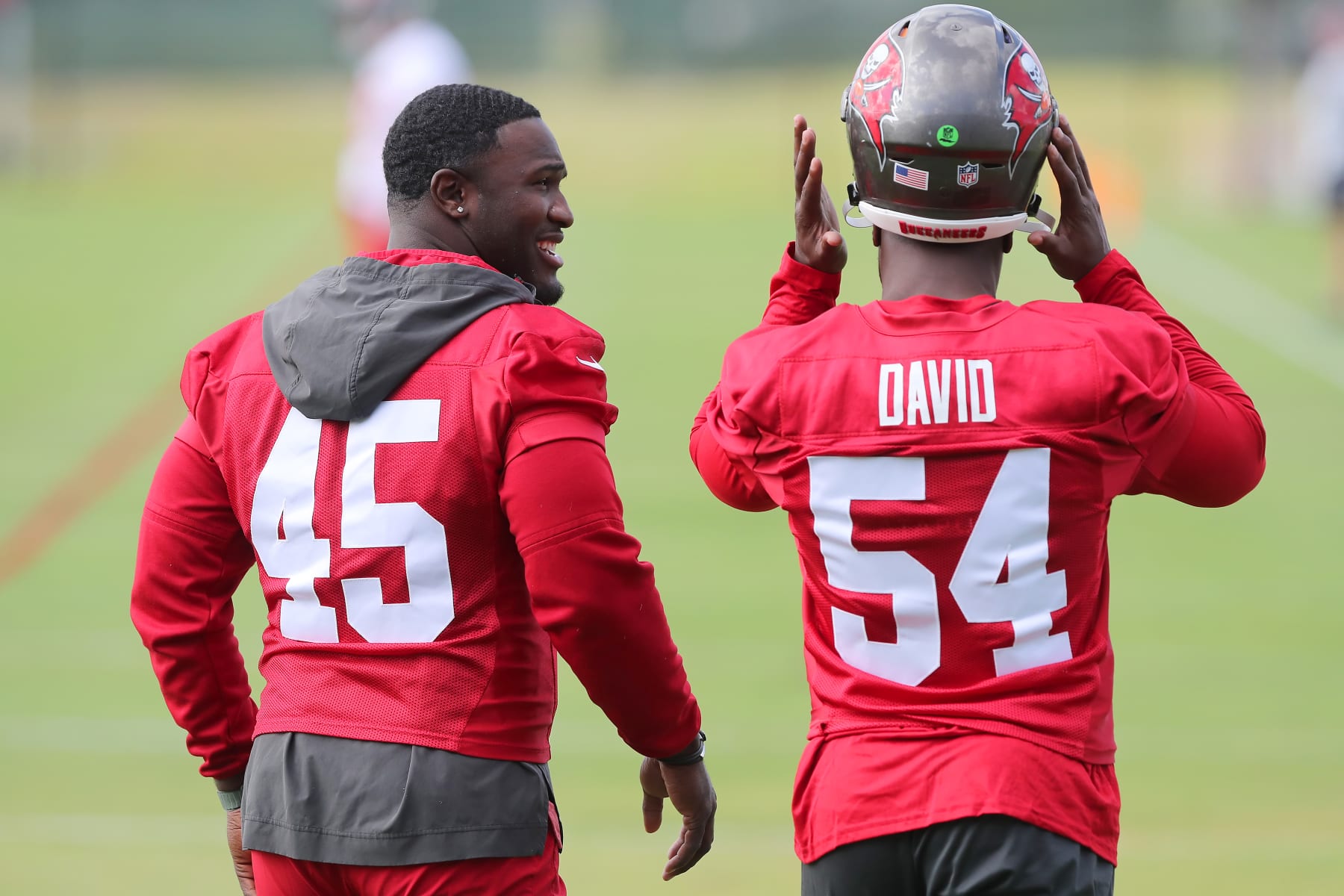 TAMPA, FL - JUN 13: Tampa Bay Buccaneers Linebackers Devin White (45) and Lavonte David (54) walk onto the field during the Tampa Bay Buccaneers Minicamp on June 13, 2023 at the AdventHealth Training Center at One Buccaneer Place in Tampa, Florida. (Photo by Cliff Welch/Icon Sportswire via Getty Images)
