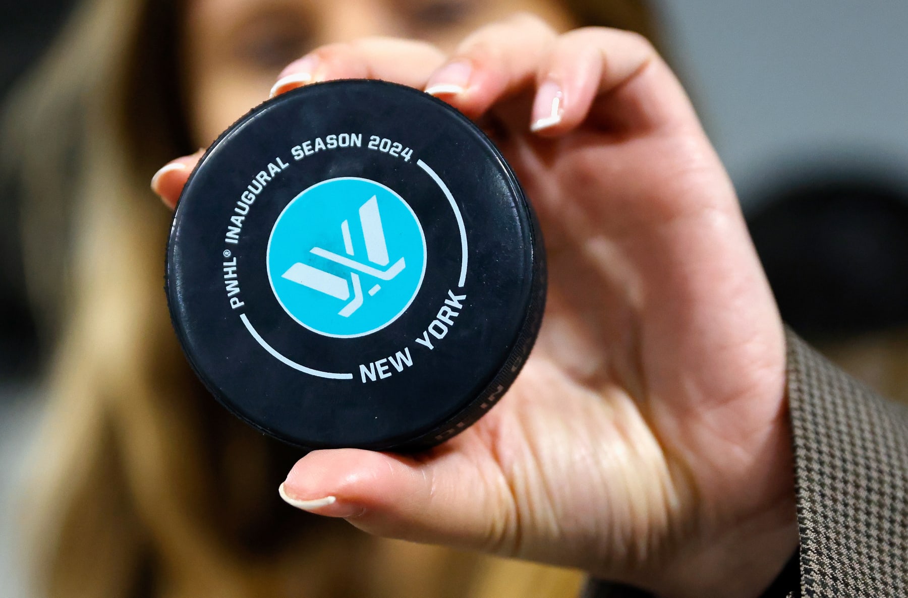ELMONT, NEW YORK - JANUARY 10: A closeup view of the inaugural season puck prior to the game between New York and Montreal at UBS Arena on January 10, 2024 in Elmont, New York. This is the first season for the team and the league. This game was the inaugural one at the arena, as the team  splits their schedule between here and Bridgeport, and their franchise opening game was held there.  (Photo by Bruce Bennett/Getty Images)