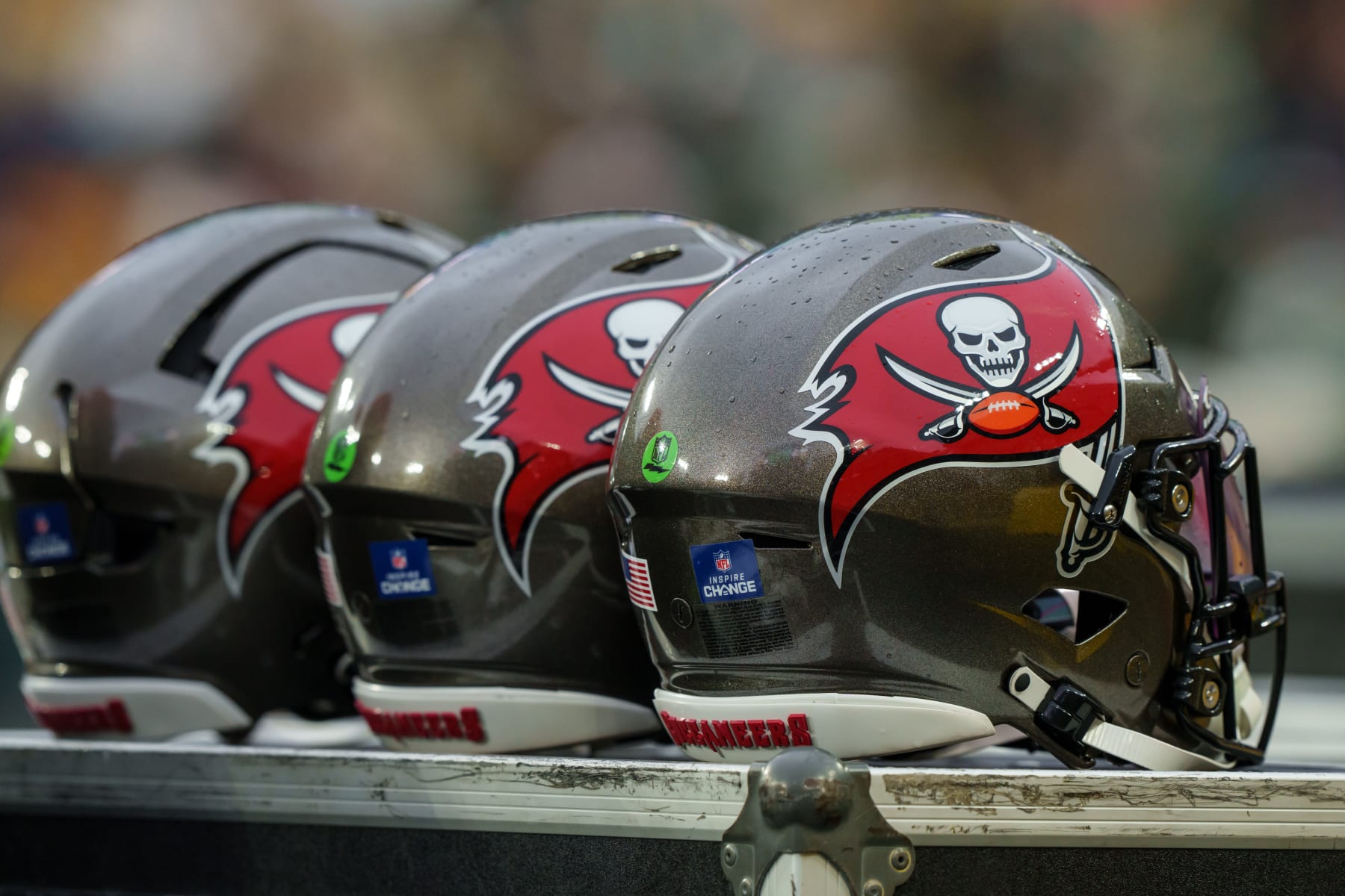 GREEN BAY, WISCONSIN - DECEMBER 17: Tampa Bay Buccaneers helmets sit atop an equipment box during an NFL football game against the Green Bay Packers at Lambeau Field on December 17, 2023 in Green Bay, Wisconsin. (Photo by Todd Rosenberg/Getty Images)
