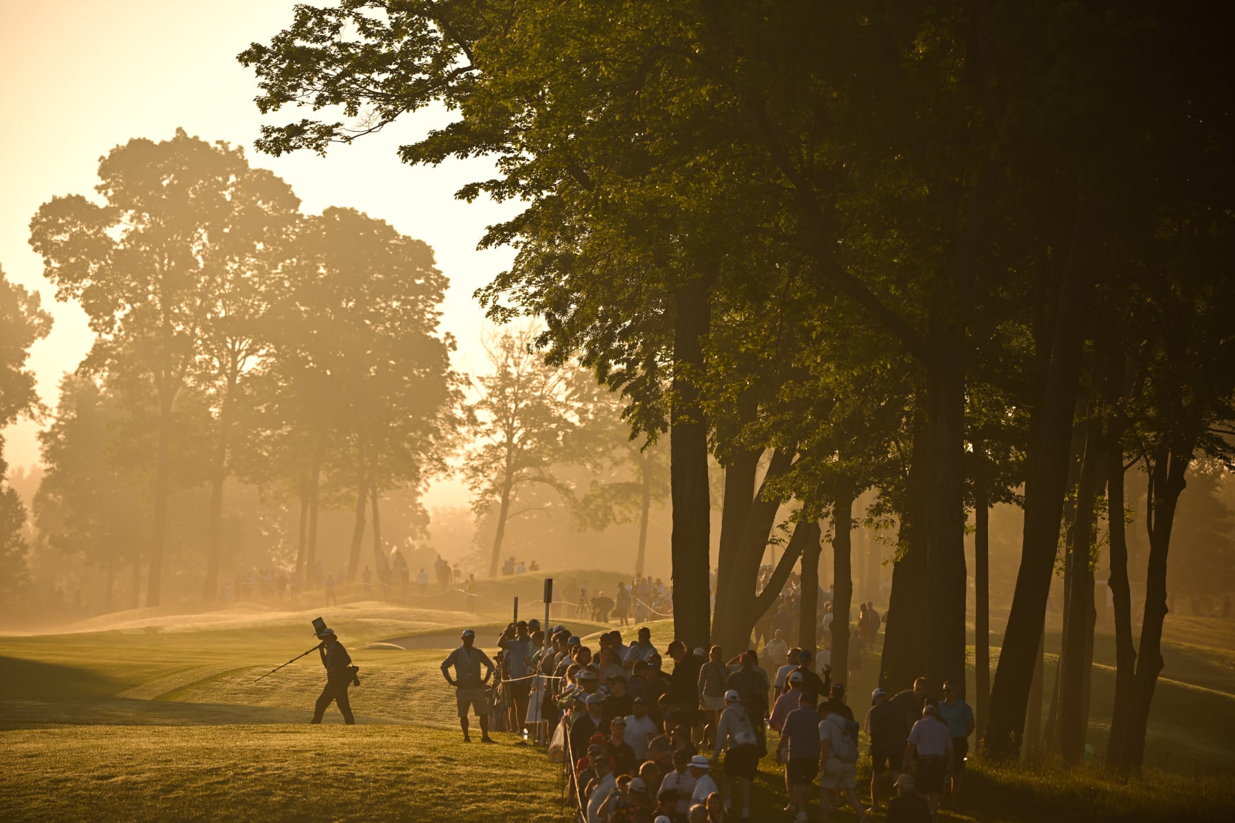 LOUISVILLE, KENTUCKY - MAY 16: Fans stand along the 10th fairway during a fog delay during the first round of PGA Championship at Valhalla Golf Club on May 16, 2024 in Louisville, Kentucky. (Photo by Ben Jared/PGA TOUR via Getty Images)