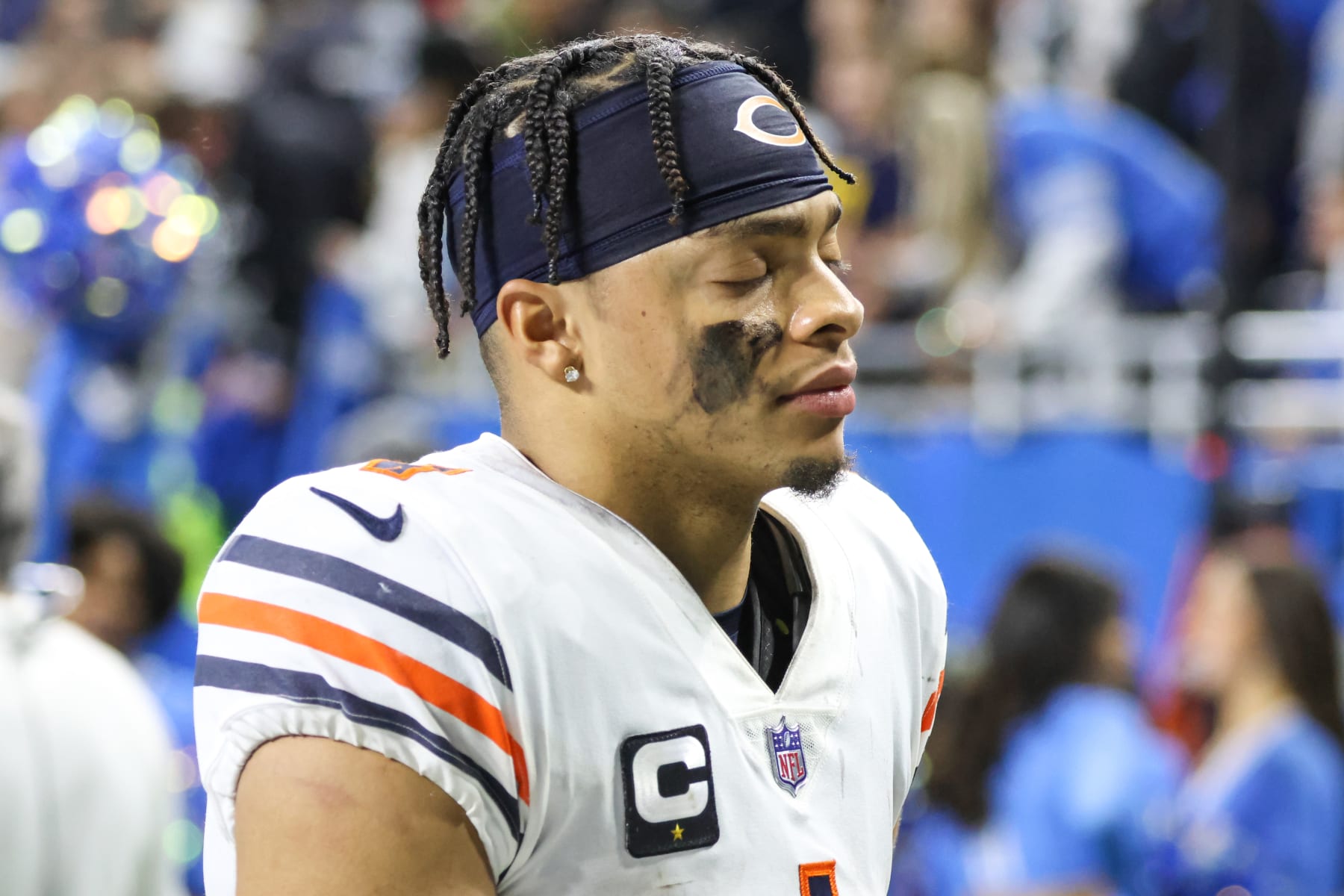 DETROIT, MI - JANUARY 01:  Chicago Bears quarterback Justin Fields (1) closes his eyes as he walks off the field at the conclusion of an NFL football game between the Chicago Bears and the Detroit Lions on January 1, 2023 at Ford Field in Detroit, Michigan.  (Photo by Scott W. Grau/Icon Sportswire via Getty Images)
