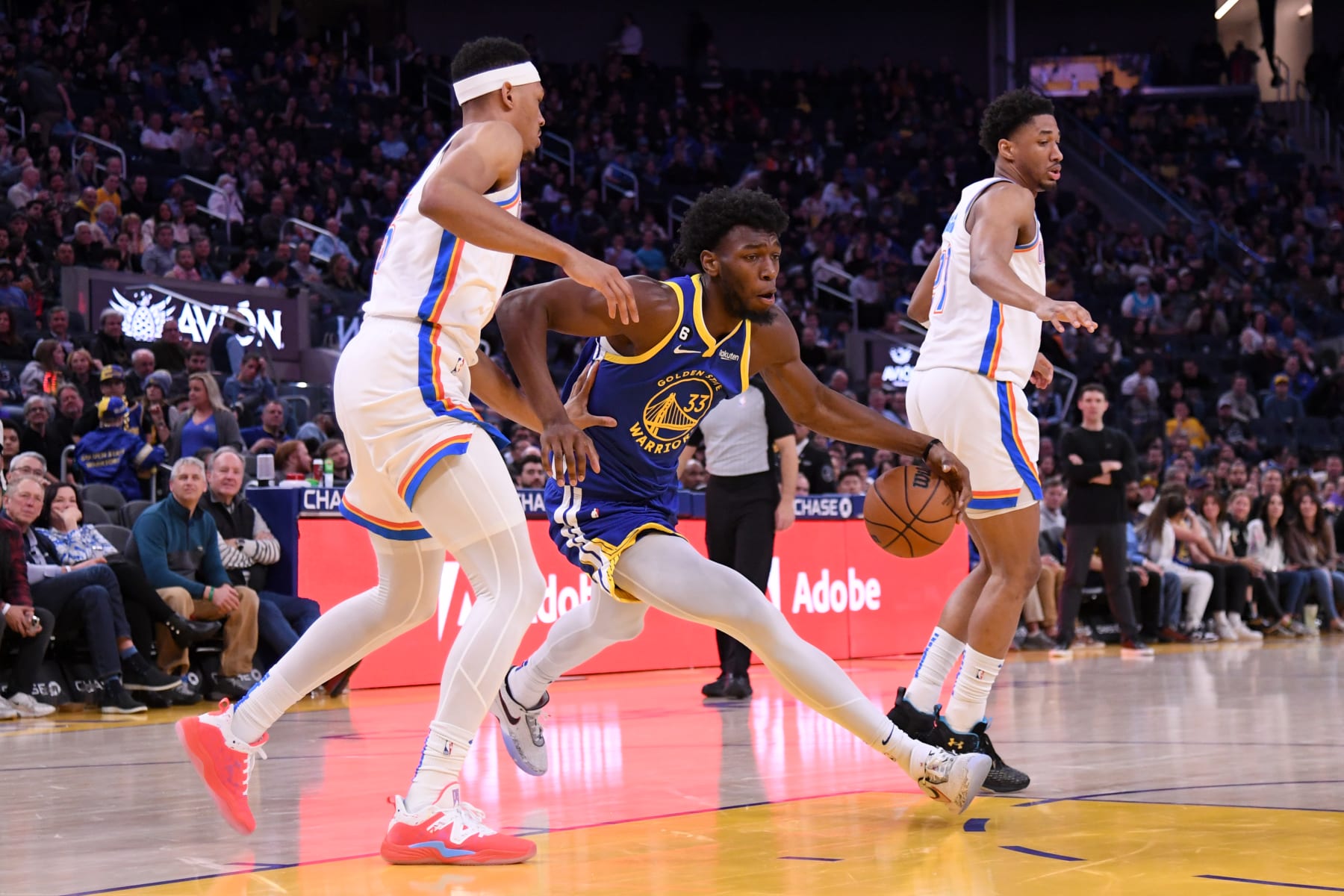 SAN FRANCISCO, CA - FEBRUARY 6: James Wiseman #33 of the Golden State Warriors dribbles the ball during the game against the Oklahoma City Thunder on February 6, 2023 at Chase Center in San Francisco, California. NOTE TO USER: User expressly acknowledges and agrees that, by downloading and or using this photograph, user is consenting to the terms and conditions of Getty Images License Agreement. Mandatory Copyright Notice: Copyright 2023 NBAE (Photo by Noah Graham/NBAE via Getty Images)
