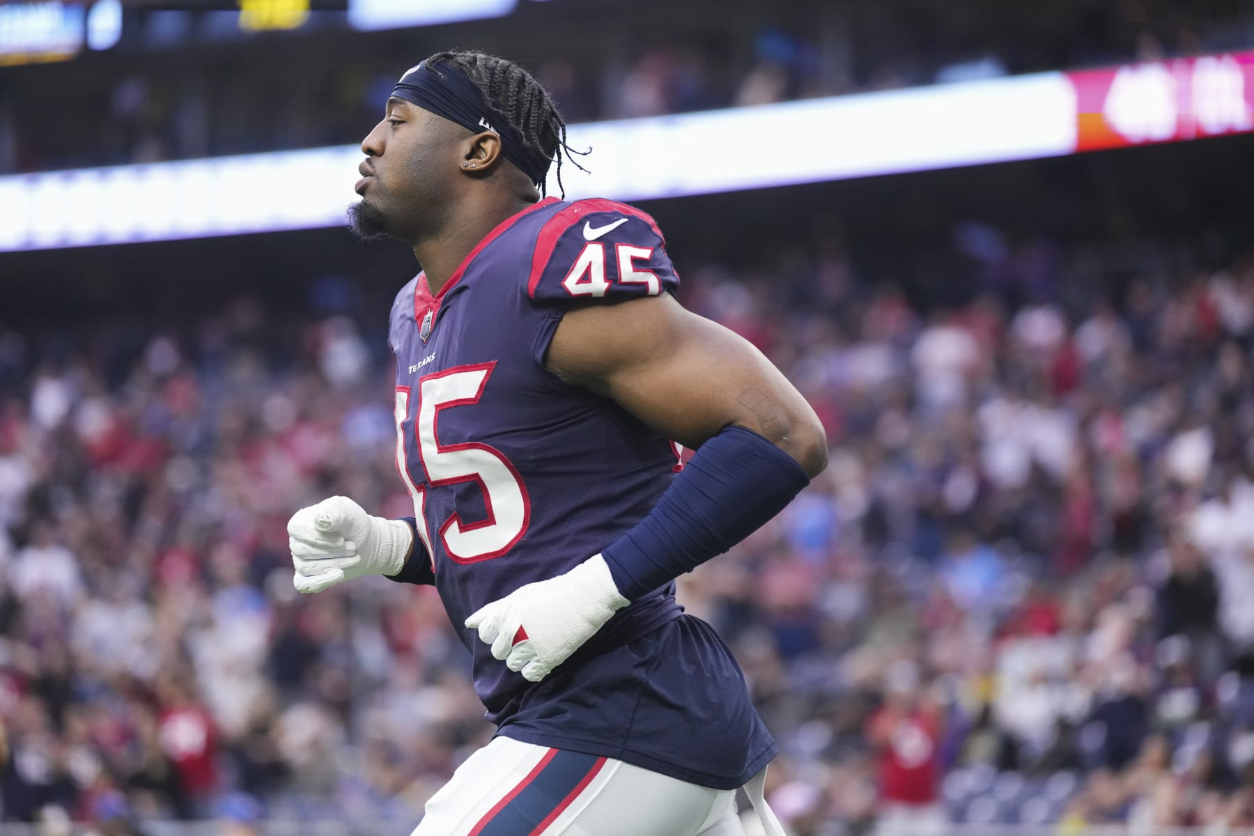 HOUSTON, TX - JANUARY 01: Ogbonnia Okoronkwo #45 of the Houston Texans runs onto the field during introductions against the Jacksonville Jaguars at NRG Stadium on January 1, 2023 in Houston, Texas. (Photo by Cooper Neill/Getty Images)