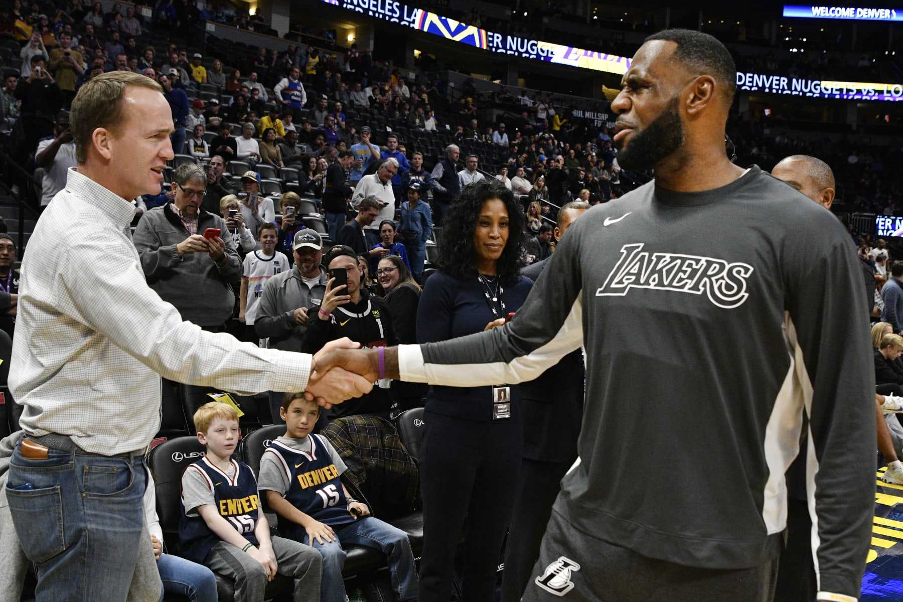 DENVER, CO - DECEMBER 03: Former Denver Broncos QB Peyton Manning, left, greets LeBron James (23) of the Los Angeles Lakers before the game against the Denver Nuggets  at the Pepsi Center December 03, 2019. (Photo by Andy Cross/MediaNews Group/The Denver Post via Getty Images)
