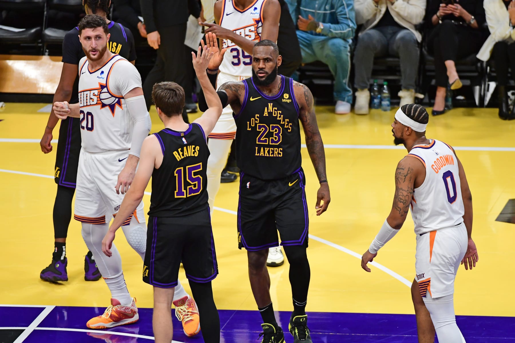 LOS ANGELES, CA - DECEMBER 5: Austin Reaves #15 high fives LeBron James #23 of the Los Angeles Lakers during the game against the Phoenix Suns during the Quarterfinals of the In-Season Tournament on December 5, 2023 at Crypto.Com Arena in Los Angeles, California. NOTE TO USER: User expressly acknowledges and agrees that, by downloading and/or using this Photograph, user is consenting to the terms and conditions of the Getty Images License Agreement. Mandatory Copyright Notice: Copyright 2023 NBAE (Photo by Adam Pantozzi/NBAE via Getty Images)