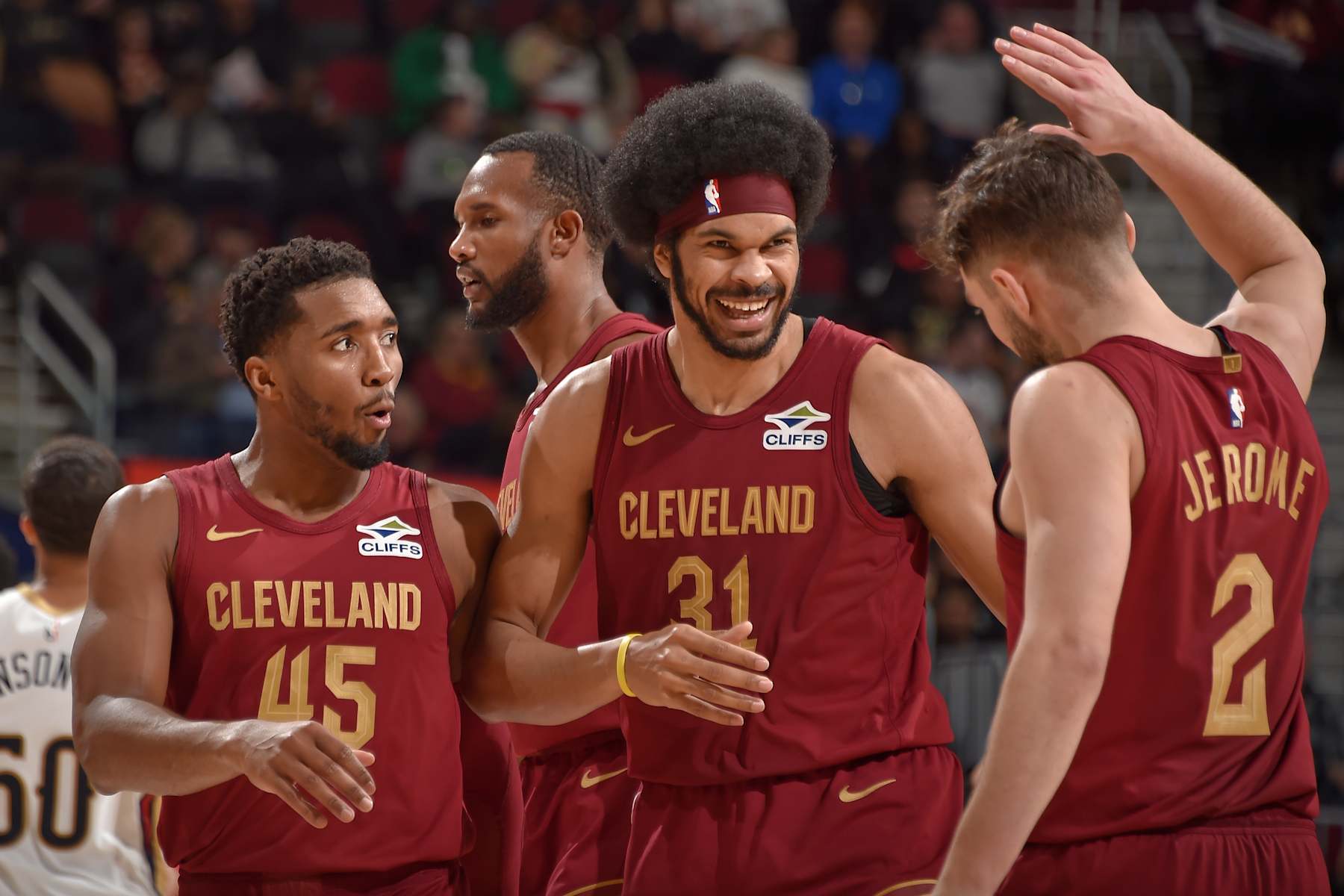 CLEVELAND, OH - NOVEMBER 20: Donovan Mitchell #45, Evan Mobley #4, Jarrett Allen #31 and Ty Jerome #2 of the Cleveland Cavaliers celebrate during the game against the New Orleans Pelicans on November 20, 2024 at Rocket Mortgage FieldHouse in Cleveland, Ohio. NOTE TO USER: User expressly acknowledges and agrees that, by downloading and/or using this Photograph, user is consenting to the terms and conditions of the Getty Images License Agreement. Mandatory Copyright Notice: Copyright 2024 NBAE (Photo by David Liam Kyle/NBAE via Getty Images)