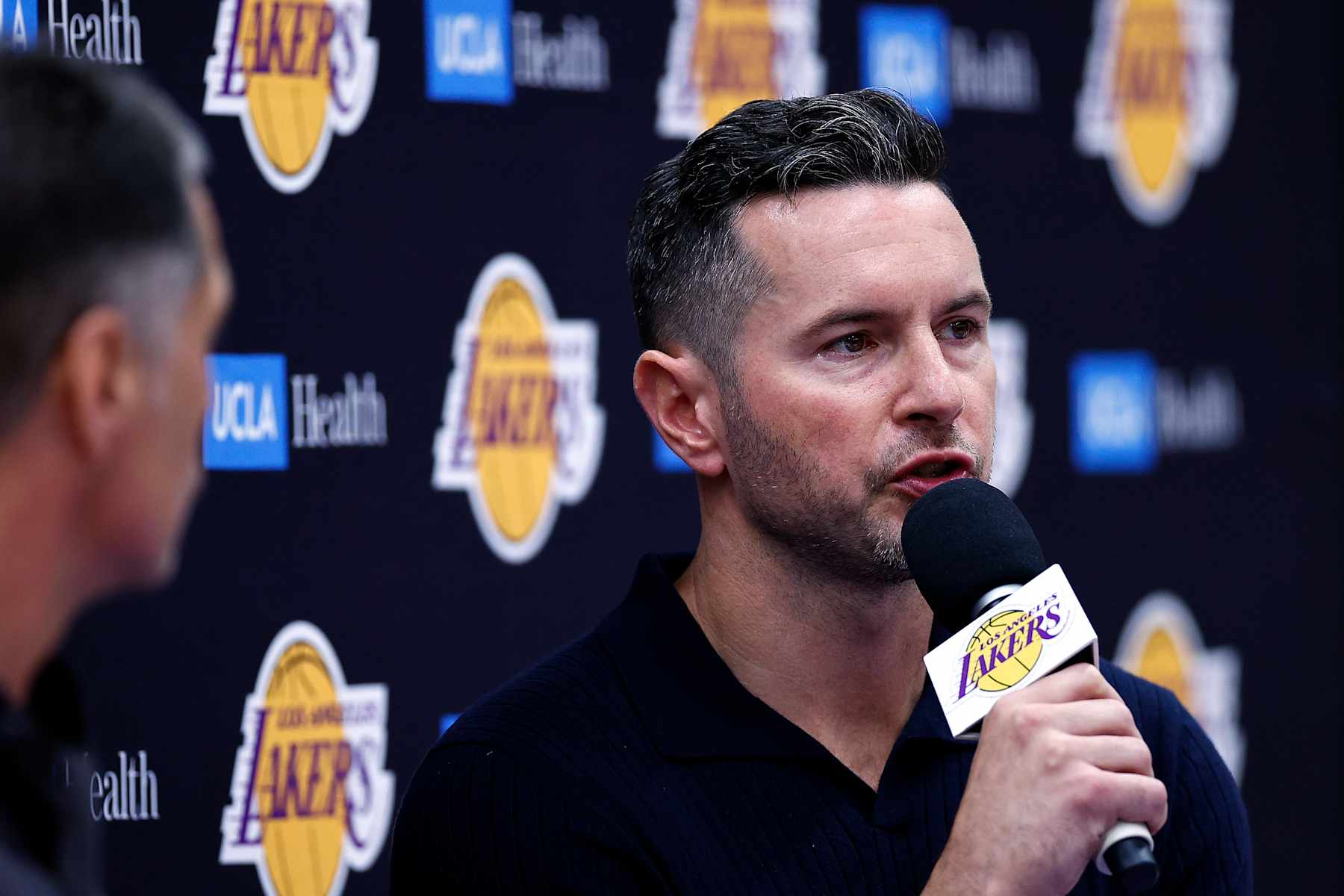 EL SEGUNDO, CALIFORNIA - SEPTEMBER 25: Head coach JJ Redick of the Los Angeles Lakers speaks with the media during a press conference at UCLA Health Training Center on September 25, 2024 in El Segundo, California.  NOTE TO USER: User expressly acknowledges and agrees that, by downloading and or using this photograph, User is consenting to the terms and conditions of the Getty Images License Agreement.  (Photo by Ronald Martinez/Getty Images)