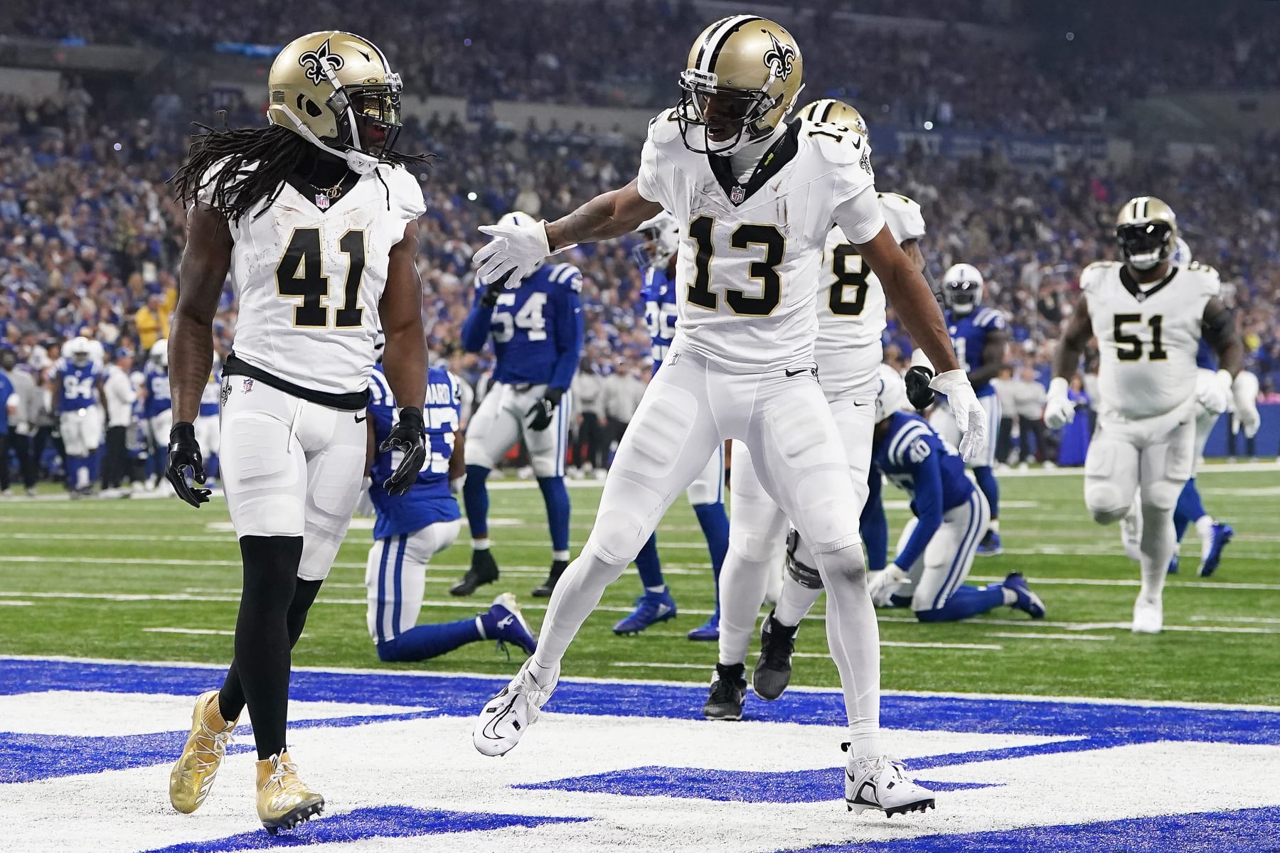 INDIANAPOLIS, INDIANA - OCTOBER 29: Alvin Kamara #41 of the New Orleans Saints and Michael Thomas #13 of the New Orleans Saints celebrate after Kamara's receiving touchdown during the first quarter at Lucas Oil Stadium on October 29, 2023 in Indianapolis, Indiana. (Photo by Dylan Buell/Getty Images)