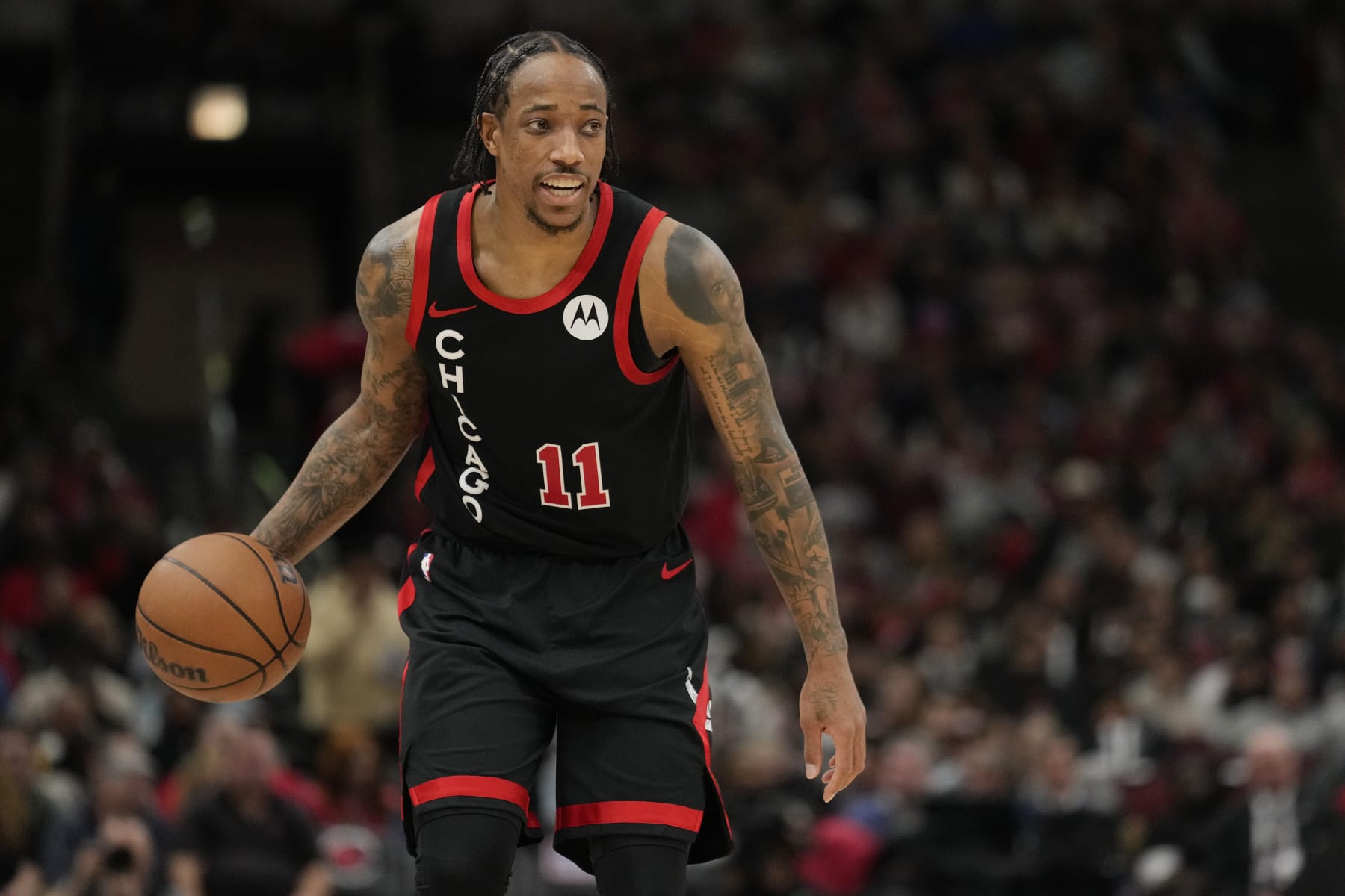 CHICAGO, ILLINOIS - APRIL 01: DeMar DeRozan #11 of the Chicago Bulls dribbles the ball during the second half against the Atlanta Hawks at the United Center on April 01, 2024 in Chicago, Illinois. NOTE TO USER: User expressly acknowledges and agrees that, by downloading and or using this photograph, User is consenting to the terms and conditions of the Getty Images License Agreement. (Photo by Patrick McDermott/Getty Images)
