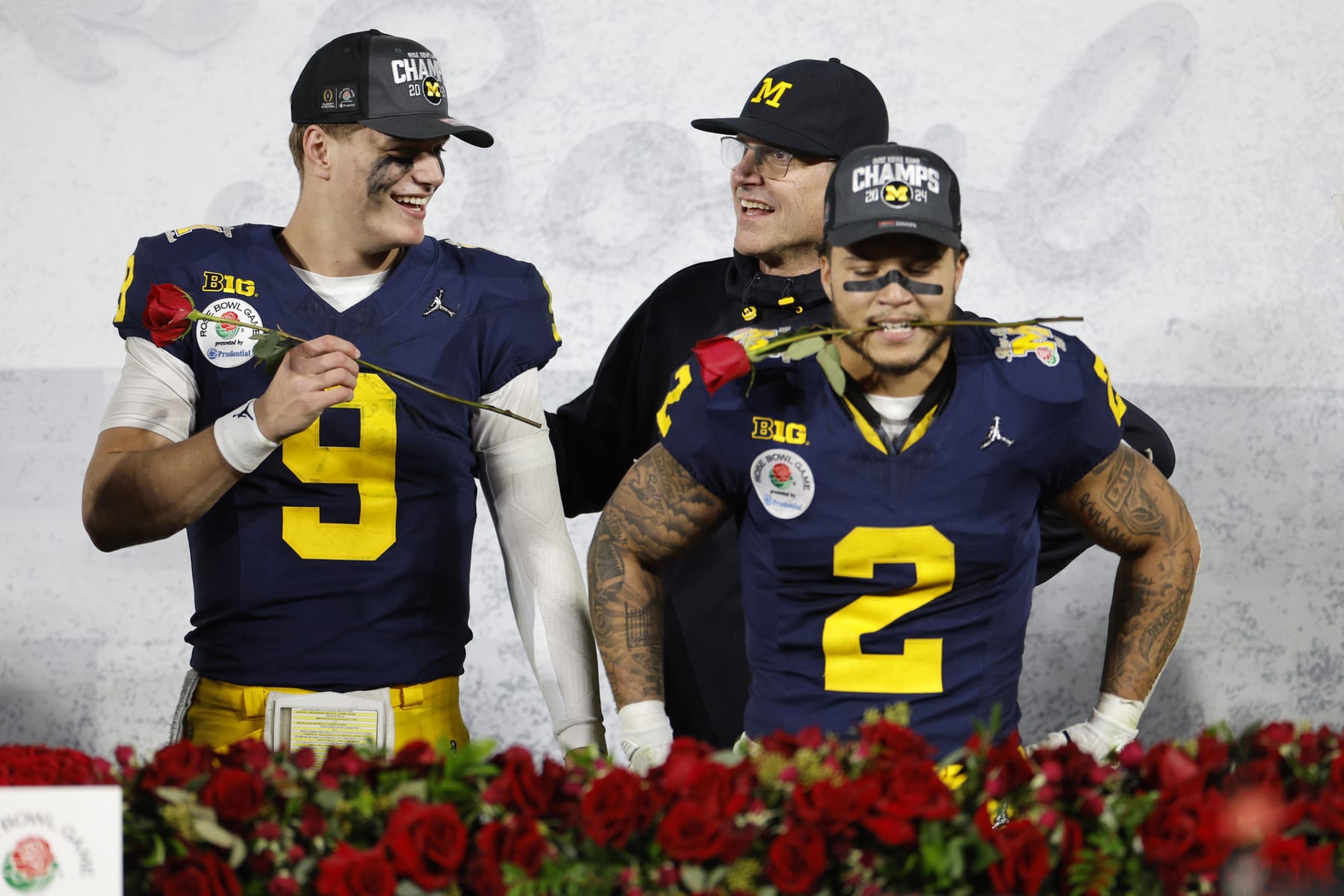 PASADENA, CALIFORNIA - JANUARY 01: J.J. McCarthy #9 and Blake Corum #2 of the Michigan Wolverines celebrate after beating the Alabama Crimson Tide 27-20 in overtime to win the CFP Semifinal Rose Bowl Game at Rose Bowl Stadium on January 01, 2024 in Pasadena, California. (Photo by Kevork Djansezian/Getty Images)
