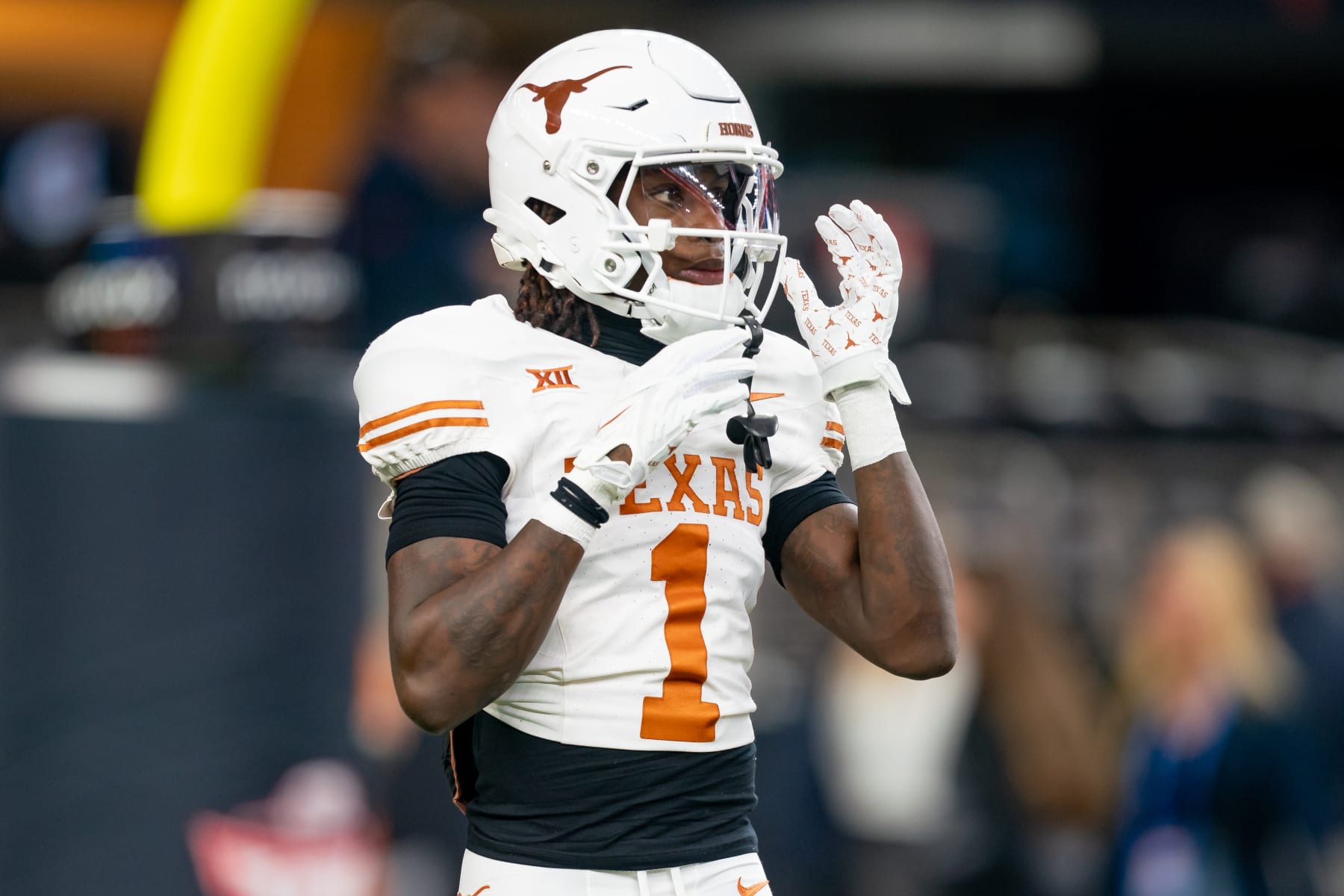 ARLINGTON, TX - DECEMBER 02: Texas Longhorns wide receiver Xavier Worthy (1) fixes his helmet before the Big 12 Championship game between the Texas Longhorns and the Oklahoma State Cowboys  on December 02, 2023 at AT&T Stadium in Arlington, TX. (Photo by Chris Leduc/Icon Sportswire via Getty Images)