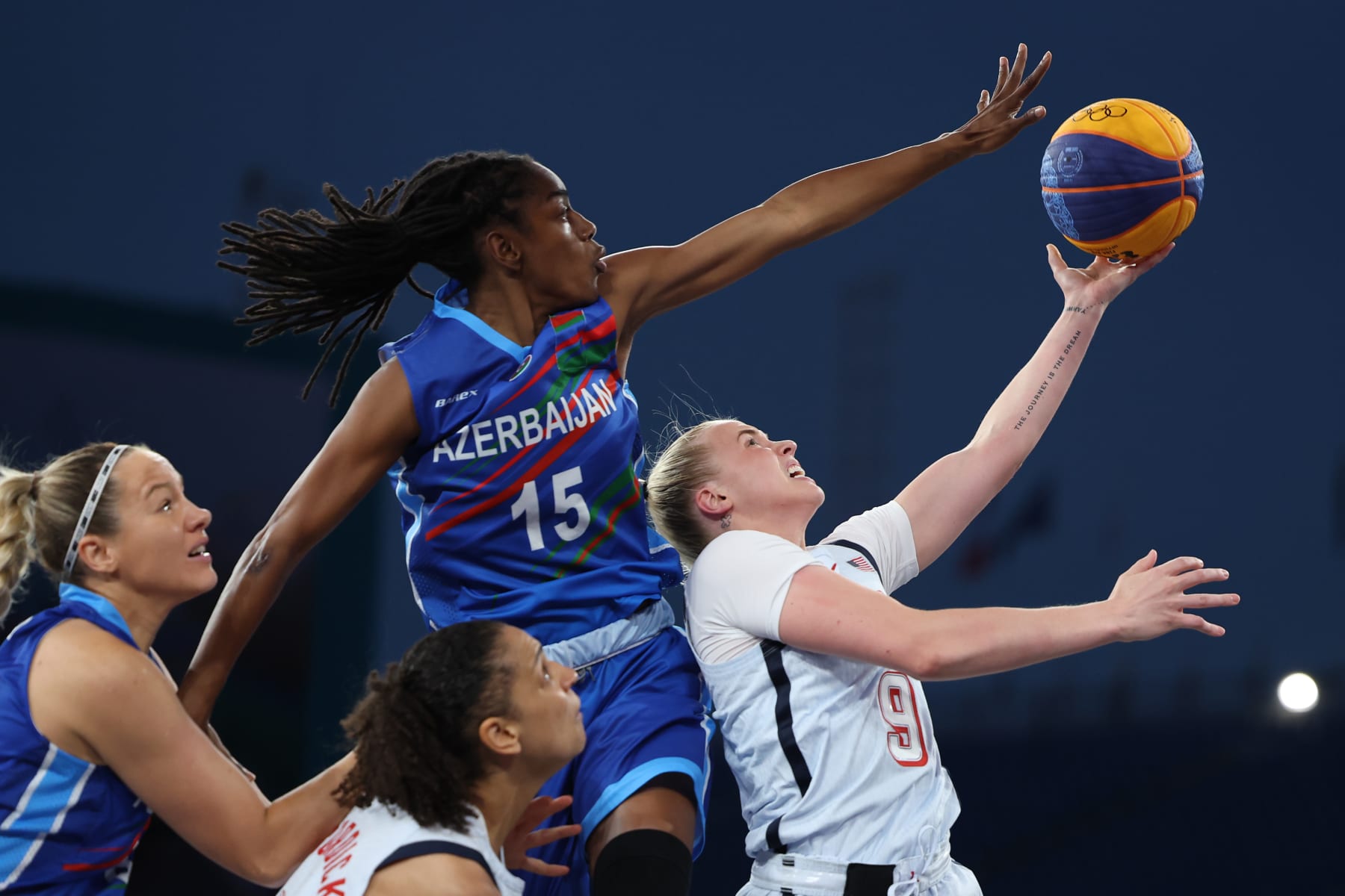PARIS, FRANCE - JULY 31: Hailey van Lith #9 of Team United States shoots the ball against Tiffany Hayes #15 of Team Azerbaijan a during a Women's Pool Round match between Azerbaijan and United States on day five of the Olympic Games Paris 2024 at Esplanade Des Invalides on July 31, 2024 in Paris, France. (Photo by Ezra Shaw/Getty Images)