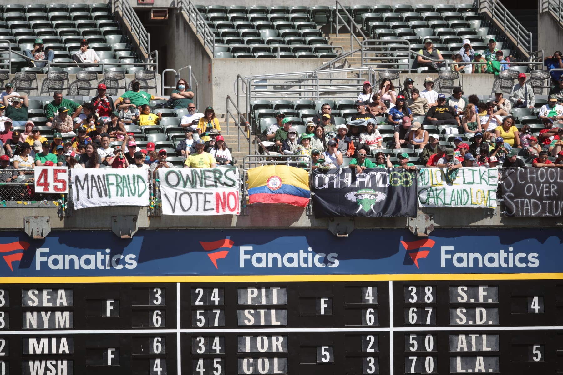 OAKLAND, CA - SEPTEMBER 3: Fans of the Oakland Athletics with signs during the game against the Los Angeles Angels at RingCentral Coliseum on September 3, 2023 in Oakland, California. The Athletics defeated the Angels 10-6. (Photo by Michael Zagaris/Oakland Athletics/Getty Images)
