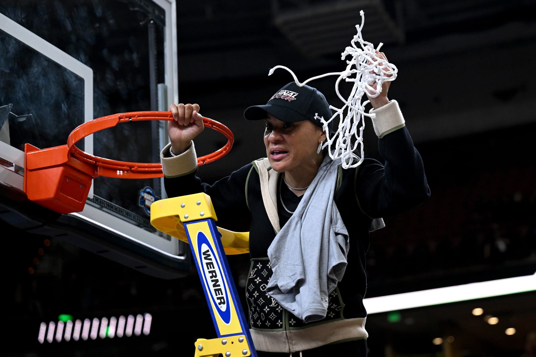 GREENVILLE, SOUTH CAROLINA - MARCH 27: Head coach Dawn Staley of the South Carolina Gamecocks cuts down the net after a win against the Maryland Terrapins during the Elite Eight round of the 2023 NCAA Women's Basketball Tournament held at Bon Secours Wellness Arena on March 27, 2023 in Greenville, South Carolina. (Photo by Grant Halverson/NCAA Photos via Getty Images)