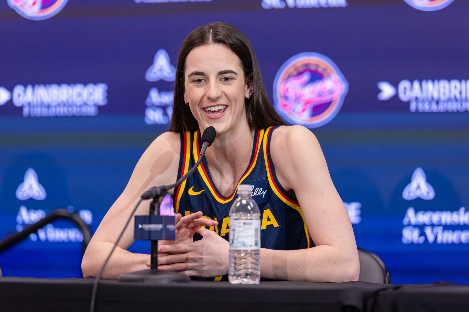INDIANAPOLIS, INDIANA - MAY 1: Caitlin Clark #22 of the Indiana Fever talks to reporters during media day activities  at Gainbridge Fieldhouse on May 1, 2024 in Indianapolis, Indiana. NOTE TO USER: User expressly acknowledges and agrees that, by downloading and or using this photograph, User is consenting to the terms and conditions of the Getty Images License Agreement.  (Photo by Michael Hickey/Getty Images)