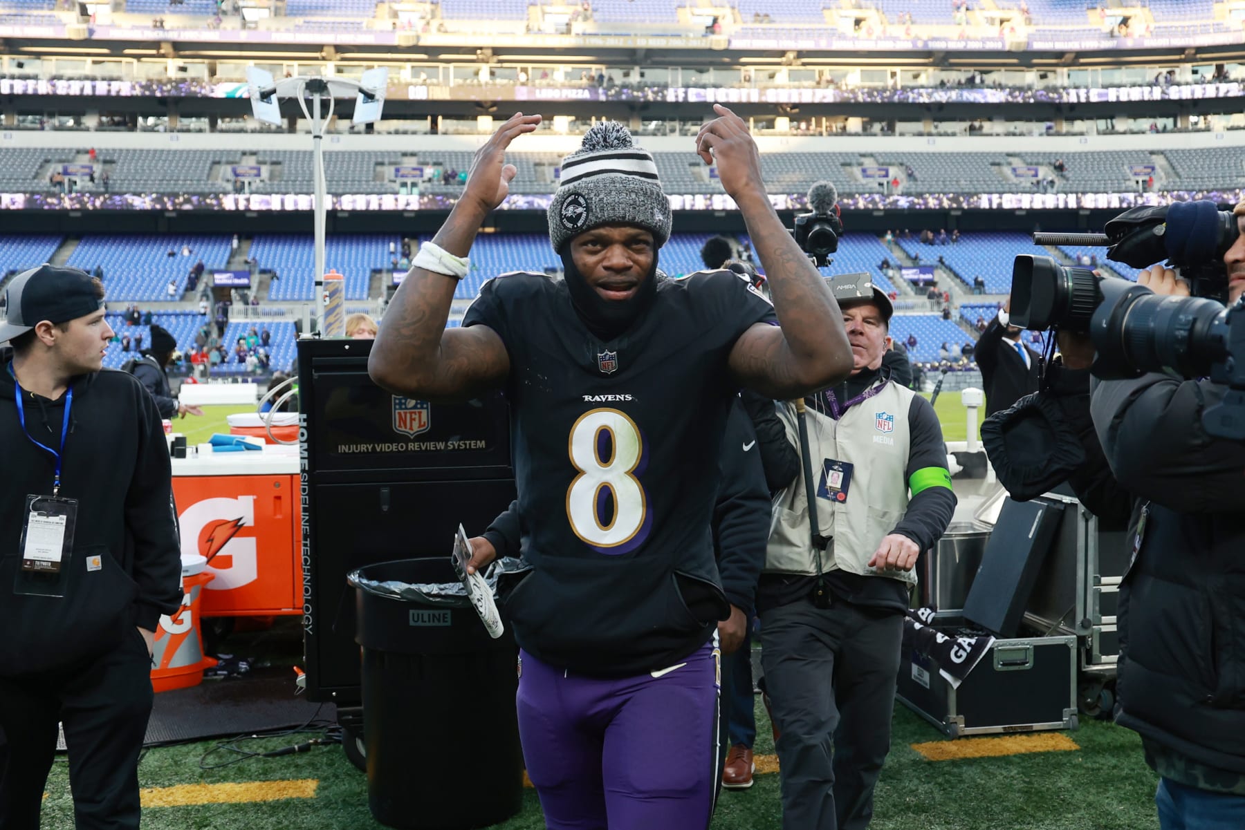 BALTIMORE, MARYLAND - DECEMBER 31: Lamar Jackson #8 of the Baltimore Ravens celebrates after defeating the Miami Dolphins at M&T Bank Stadium on December 31, 2023 in Baltimore, Maryland. (Photo by Rob Carr/Getty Images)