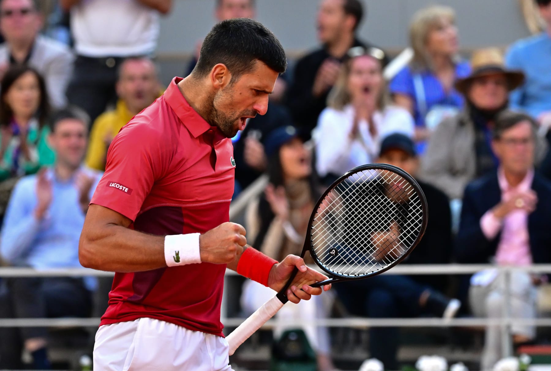 PARIS, FRANCE - JUNE 03: Novak Djokovic of Serbia celebrates a point against Francisco Cerundolo of Argentina in the Men's Singles fourth round match during Day Nine of the 2024 French Open at Roland Garros on June 03, 2024 in Paris, France. (Photo by Christian Liewig - Corbis/Getty Images)