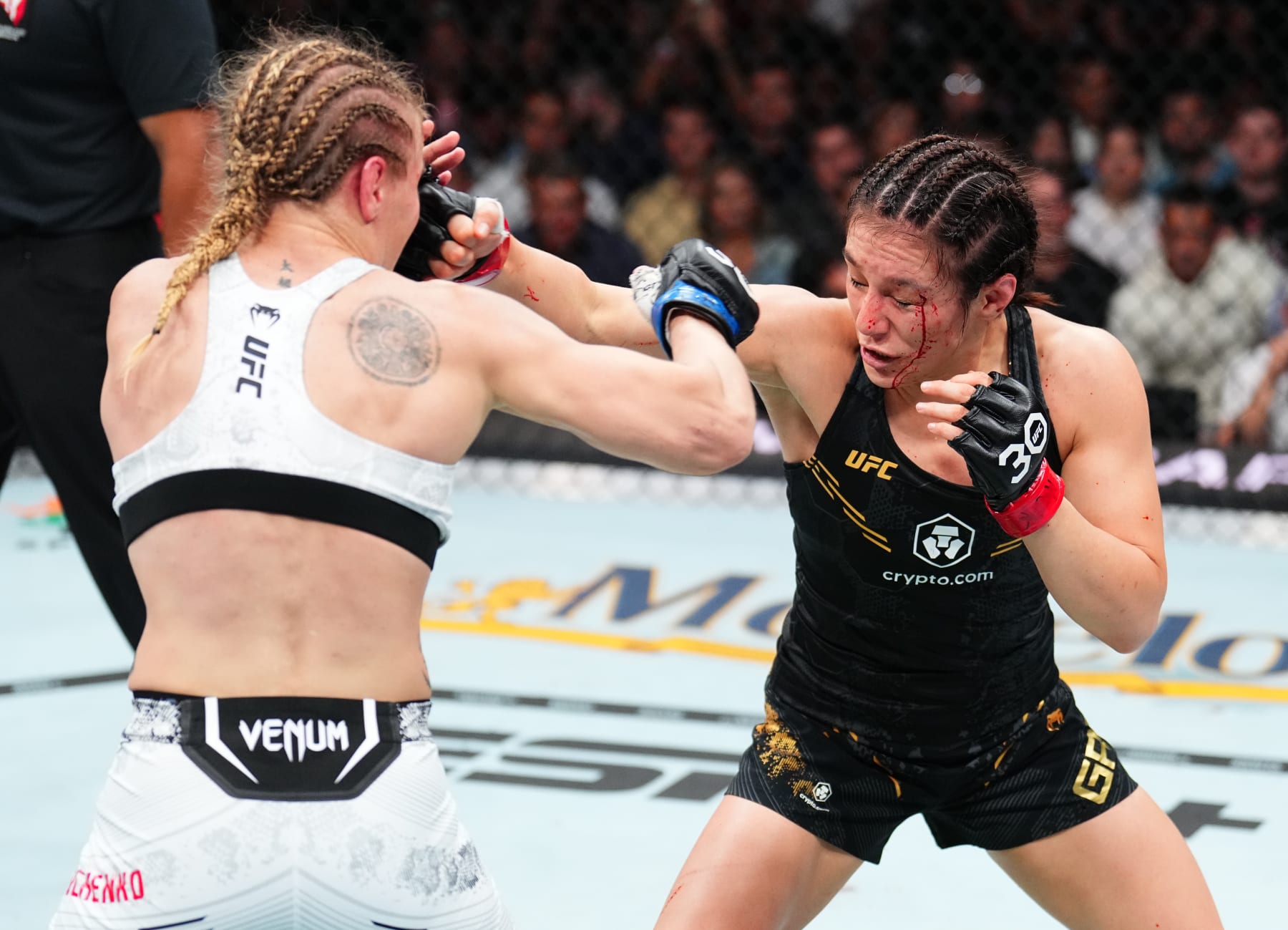 LAS VEGAS, NEVADA - SEPTEMBER 16: (R-L) Alexa Grasso of Mexico punches Valentina Shevchenko of Kyrgyzstan in the UFC flyweight championship fight during the Noche UFC event at T-Mobile Arena on September 16, 2023 in Las Vegas, Nevada. (Photo by Chris Unger/Zuffa LLC via Getty Images)