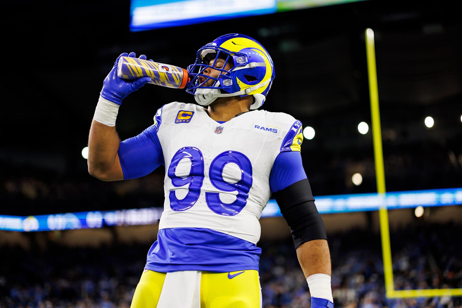 DETROIT, MICHIGAN - JANUARY 14: Aaron Donald #99 of the Los Angeles Rams drinks from a Gatorade water bottle during pregame warmups prior to an NFC Wild Card Playoff football game against the Detroit Lions at Ford Field on January 14, 2024 in Detroit, Michigan. (Photo by Ryan Kang/Getty Images)
