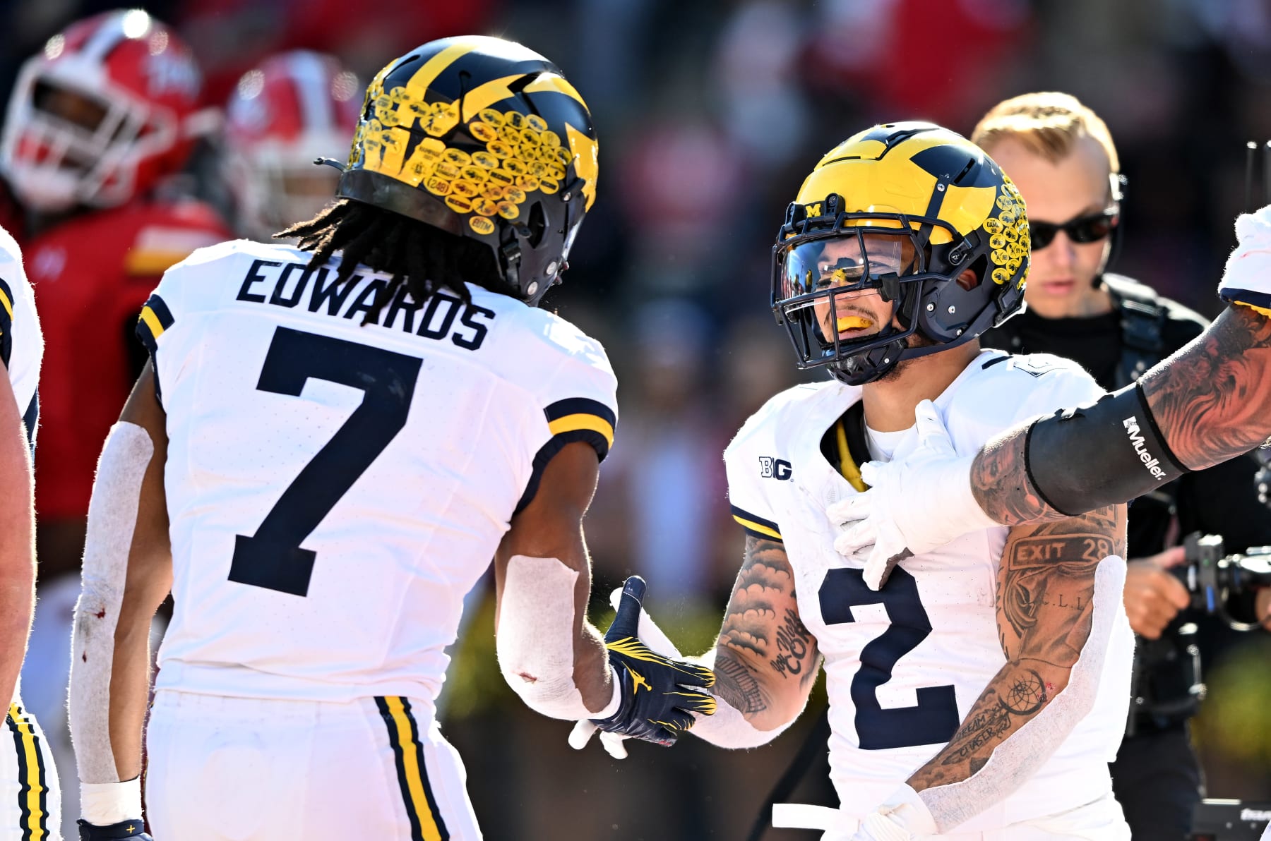 COLLEGE PARK, MARYLAND - NOVEMBER 18: Blake Corum #2 of the Michigan Wolverines celebrates with Donovan Edwards #7 after scoring a touchdown in the second quarter against the Maryland Terrapins at SECU Stadium on November 18, 2023 in College Park, Maryland. (Photo by Greg Fiume/Getty Images)