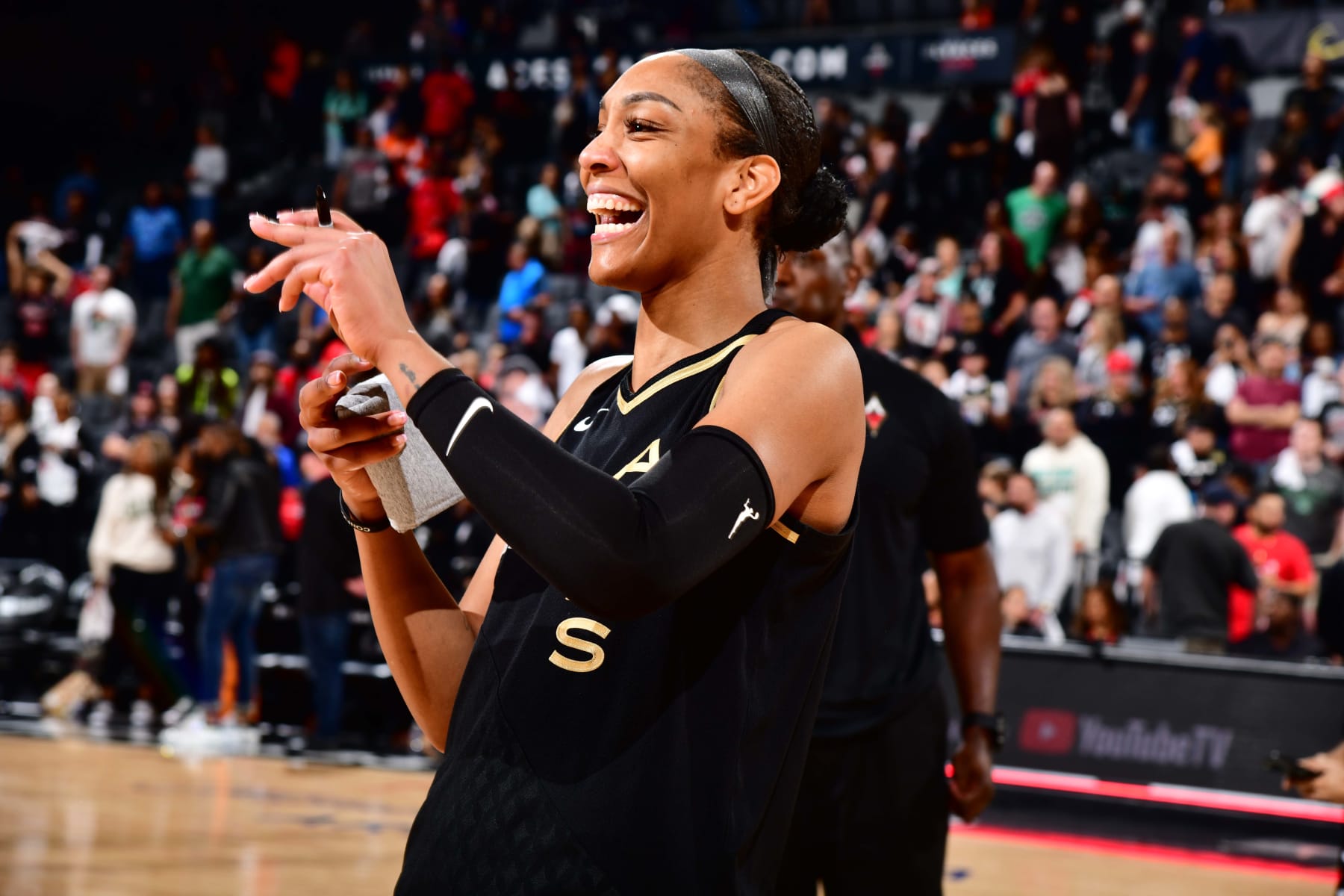 LAS VEGAS, NV - OCTOBER 11: A'ja Wilson #22 of the Las Vegas Aces smiles after the game against the New York Liberty during Game 2 of the 2023 WNBA Finals on October 11, 2023 at the Michelob ULTRA Arena in Las Vegas, Nevada. NOTE TO USER: User expressly acknowledges and agrees that, by downloading and or using this photograph, User is consenting to the terms and conditions of the Getty Images License Agreement. Mandatory Copyright Notice: Copyright 2023 NBAE (Photo by Barry Gossage/NBAE via Getty Images)