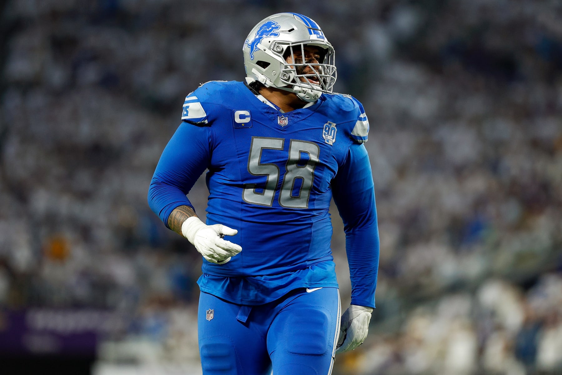 MINNEAPOLIS, MINNESOTA - DECEMBER 24: Penei Sewell #58 of the Detroit Lions celebrates a touchdown against the Minnesota Vikings in the second half at U.S. Bank Stadium on December 24, 2023 in Minneapolis, Minnesota. The Lions defeated the Vikings 30-24. (Photo by David Berding/Getty Images)