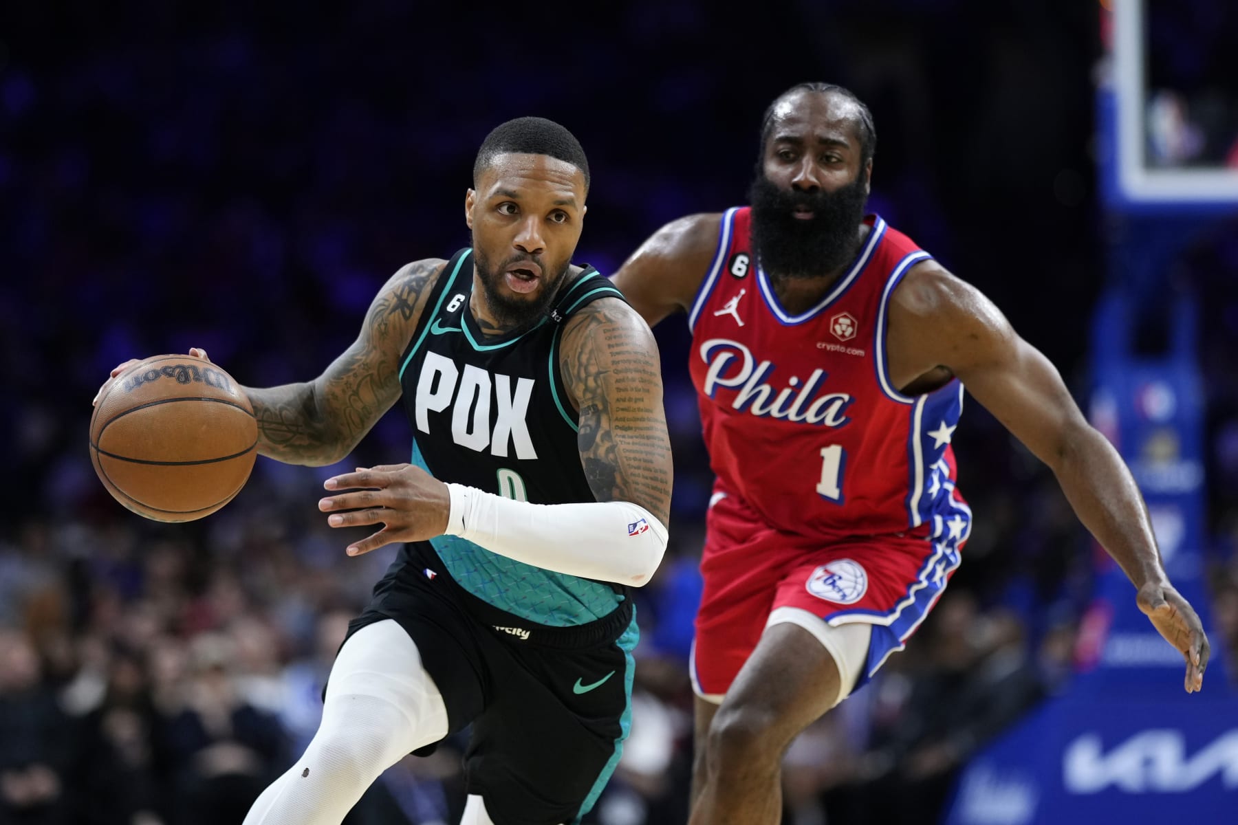 Portland Trail Blazers' Damian Lillard, left, dribbles past Philadelphia 76ers' James Harden during the first half of an NBA basketball game, Friday, March 10, 2023, in Philadelphia. (AP Photo/Matt Slocum)