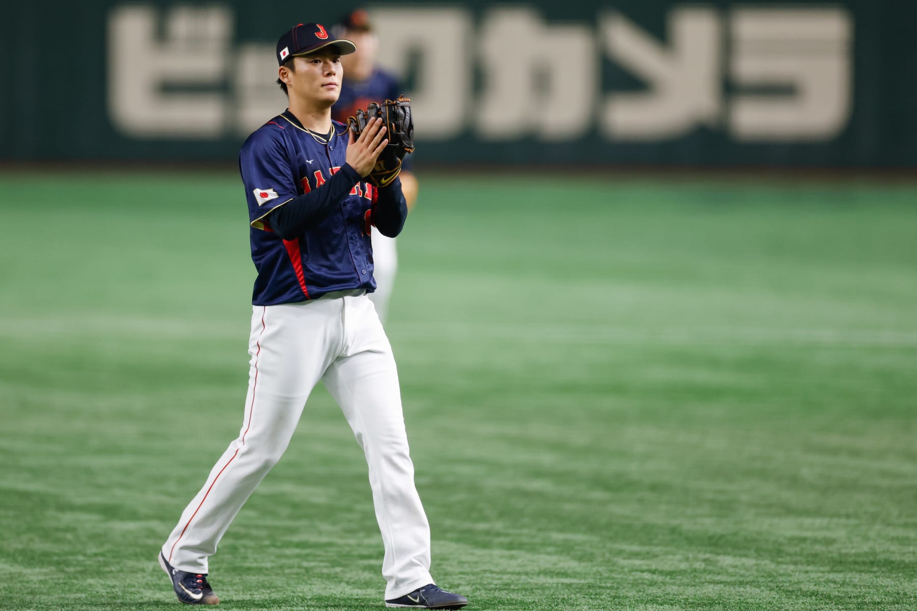 BUNKYO CITY, JAPAN - MARCH 12:   Yoshinobu Yamamoto #18 of Team Japan reacts after pitching during Game 8 of Pool B between Team Japan and Team Australia at Tokyo Dome on Sunday, March 12, 2023 in Bunkyo City, Japan. (Photo by Yuki Taguchi/WBCI/MLB Photos via Getty Images)