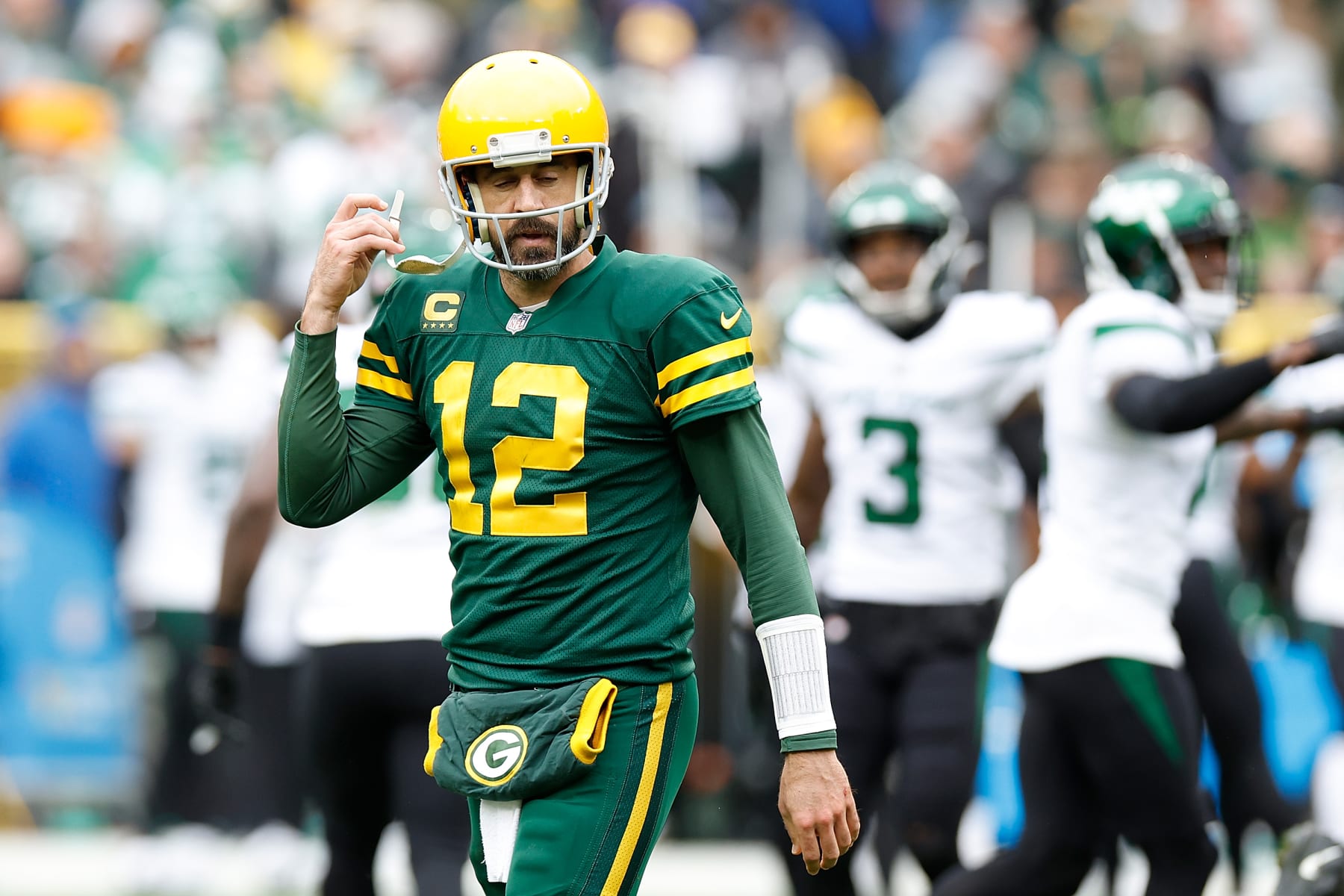 GREEN BAY, WISCONSIN - OCTOBER 16: Aaron Rodgers #12 of the Green Bay Packers reacts after a fumble recovered by the New York Jets at Lambeau Field on October 16, 2022 in Green Bay, Wisconsin. Jets defeated the Packers 27-10. (Photo by John Fisher/Getty Images)