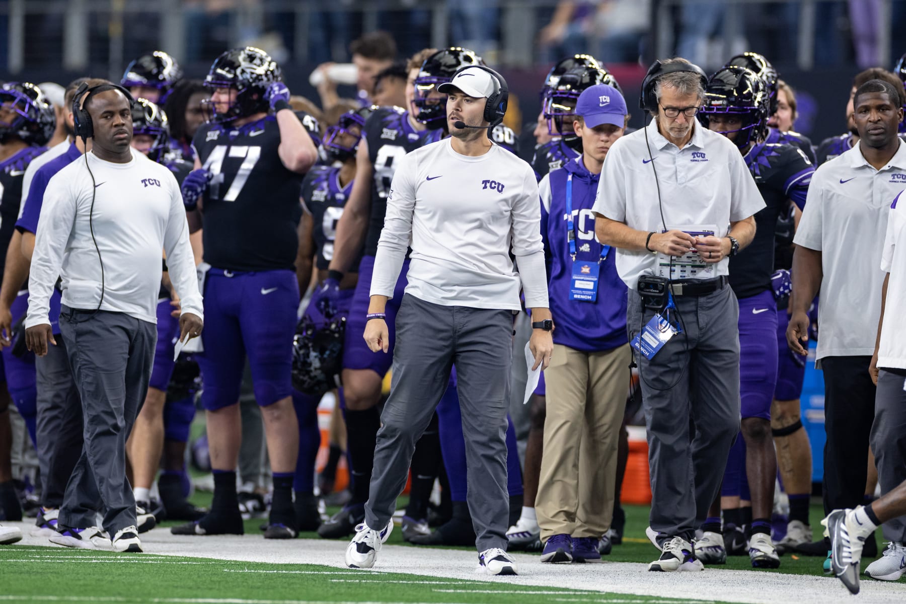 ARLINGTON, TX - DECEMBER 03: TCU offensive coordinator Garrett Riley looks on from the sideline during the Big 12 Championship game between the Kansas State Wildcats and TCU Horned Frogs on December 03, 2022 at AT&T Stadium in Arlington, TX.  (Photo by Matthew Visinsky/Icon Sportswire via Getty Images)