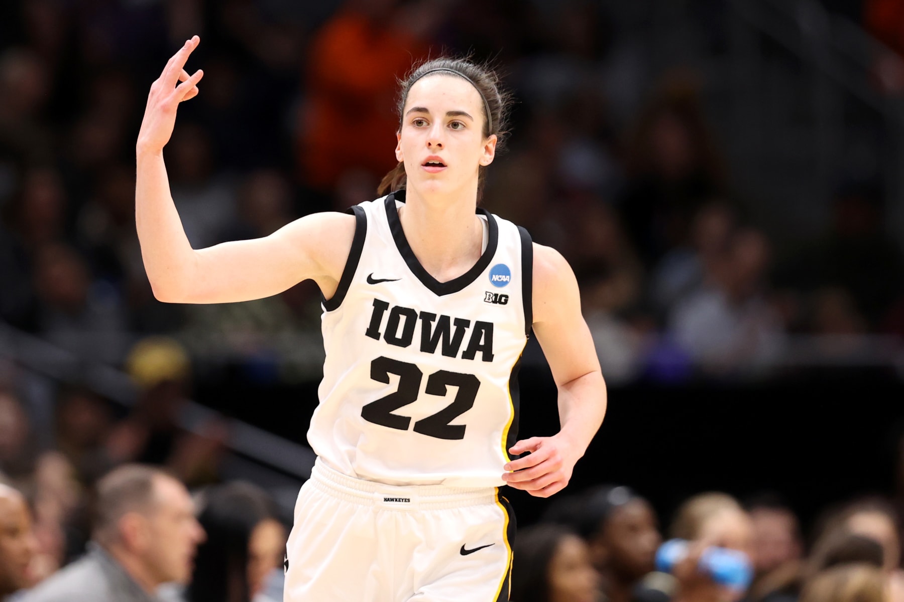SEATTLE, WASHINGTON - MARCH 24: Caitlin Clark #22 of the Iowa Hawkeyes reacts after making a three point basket against the Colorado Buffaloes during the first quarter in the Sweet 16 round of the NCAA Women's Basketball Tournament at Climate Pledge Arena on March 24, 2023 in Seattle, Washington. (Photo by Steph Chambers/Getty Images)