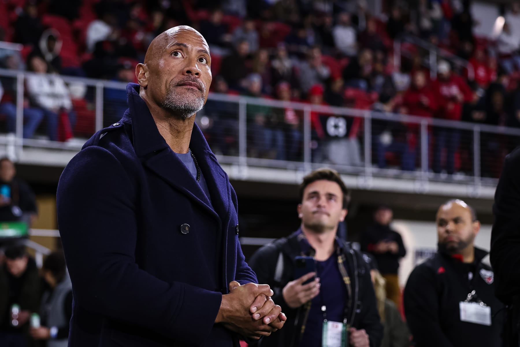 WASHINGTON, DC - FEBRUARY 19: XFL owner Dwayne Johnson looks on from the sideline during the first half of the XFL game between the DC Defenders and the Seattle Sea Dragons at Audi Field on February 19, 2023 in Washington, DC. (Photo by Scott Taetsch/Getty Images)